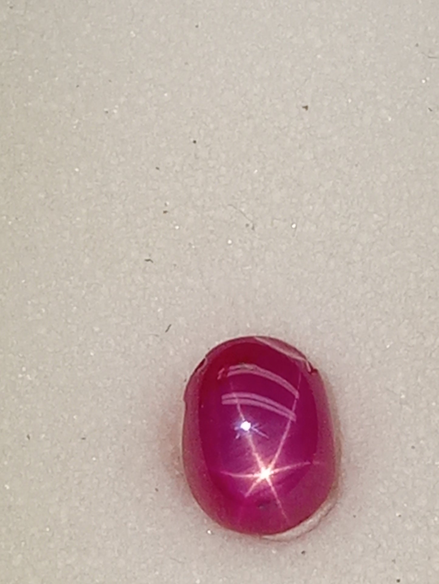 ruby gemstone Burma star, 6mmx4mm oval cabacon, 1.07ct