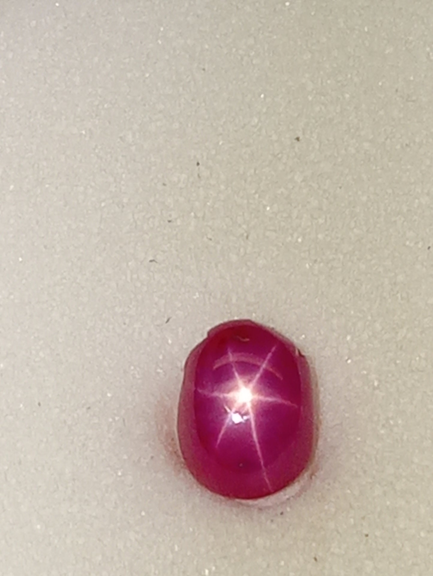 ruby gemstone Burma star, 6mmx4mm oval cabacon, 1.07ct