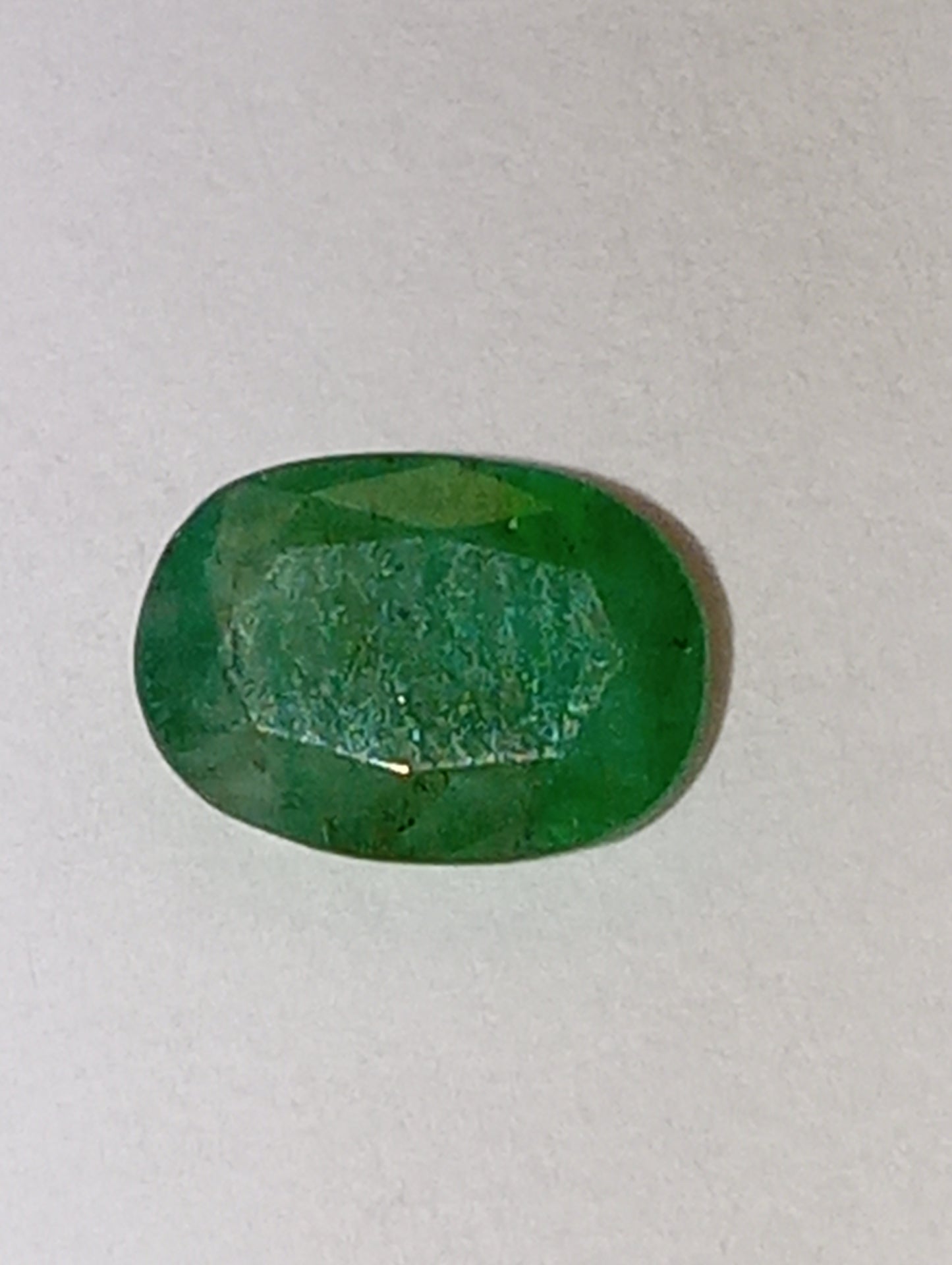 emerald gemstone, 7mmx5mm oval cut, .91ct