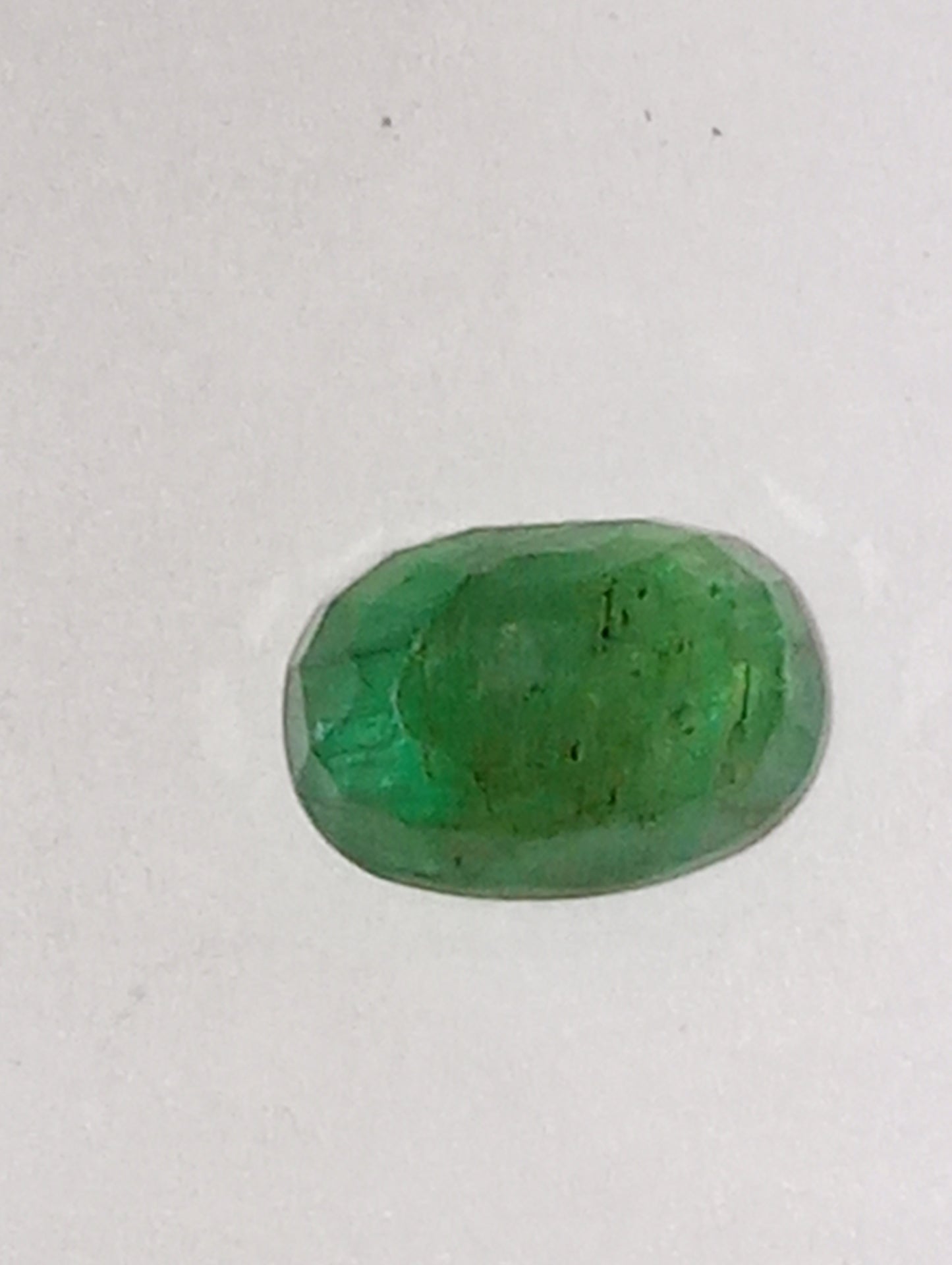 emerald gemstone, 7mmx5mm oval cut, .91ct