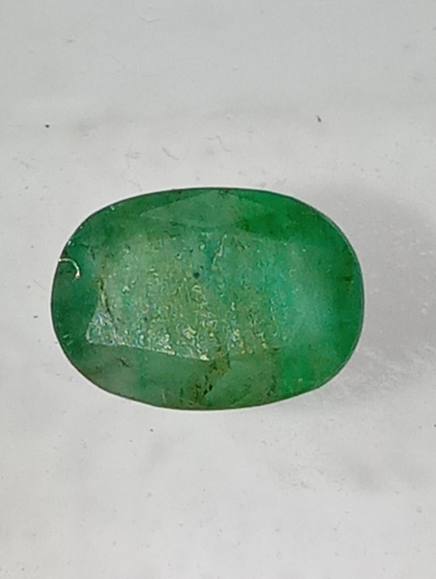 emerald gemstone, 7mmx5mm oval cut, .91ct