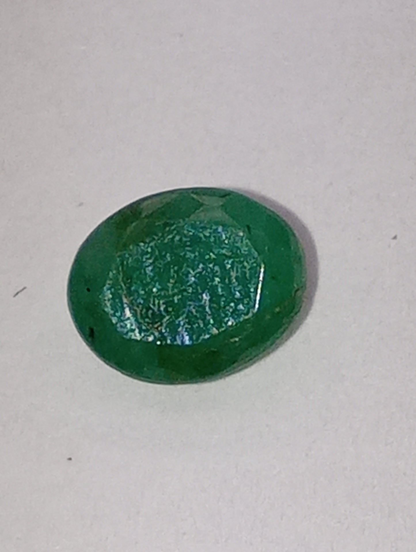 emerald gemstone, 7mmx5mm oval cut, .72ct