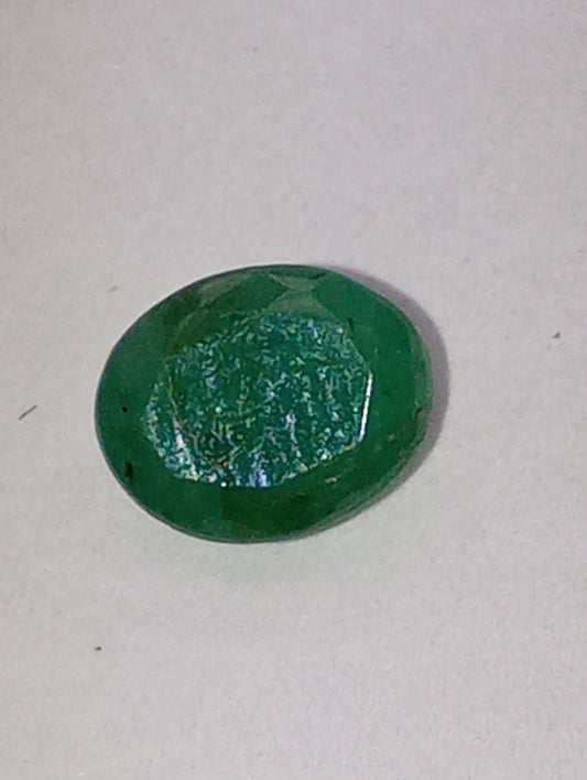 emerald gemstone, 7mmx5mm oval cut, .72ct