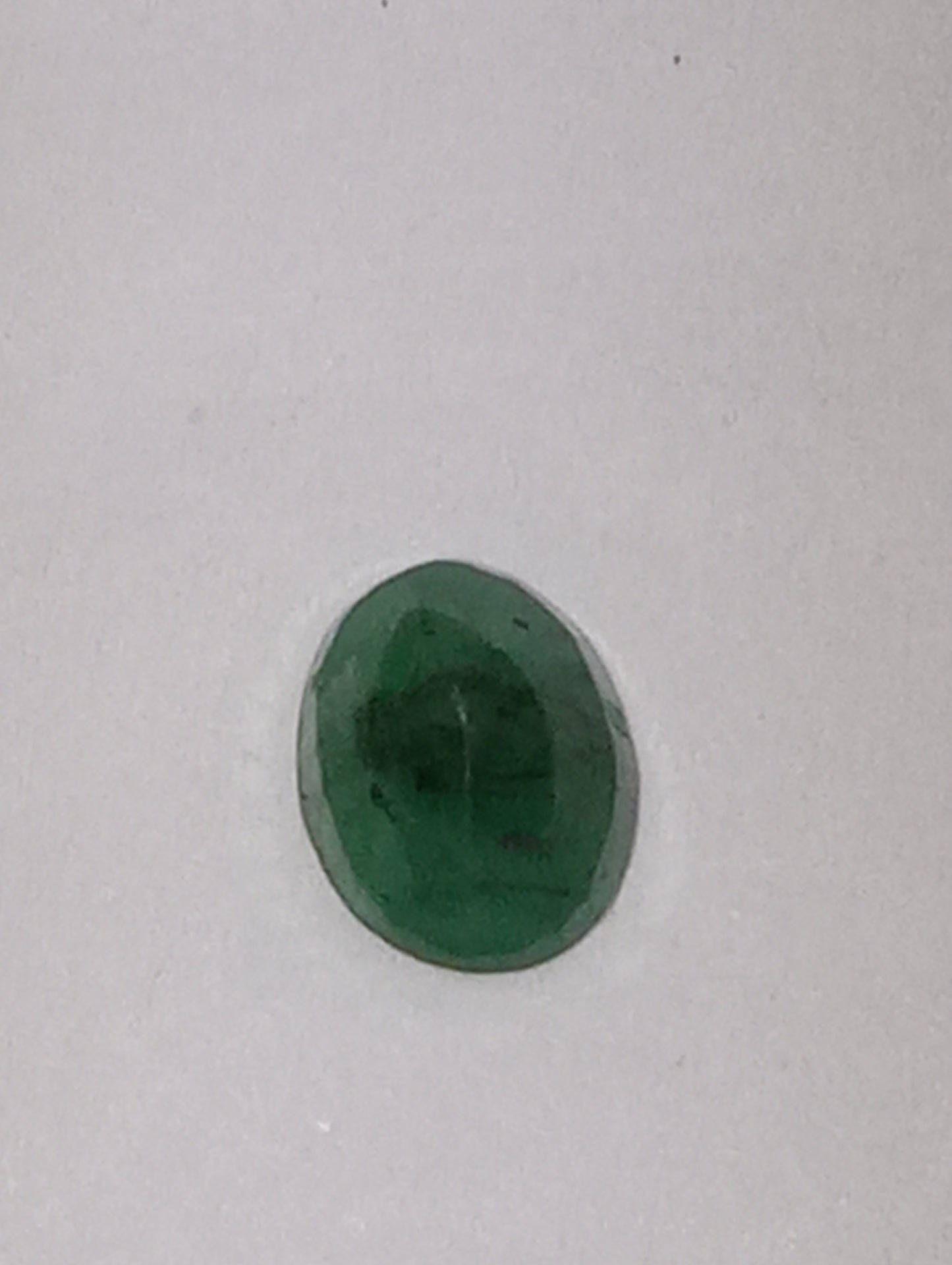 emerald gemstone, 7mmx5mm oval cut, .72ct