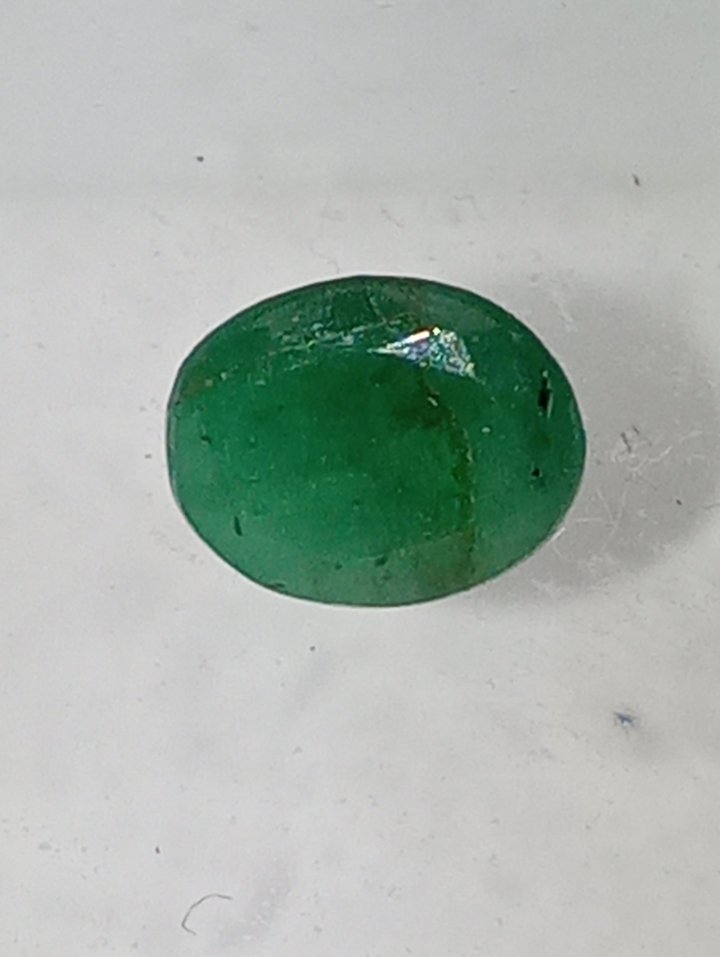 emerald gemstone, 7mmx5mm oval cut, .72ct