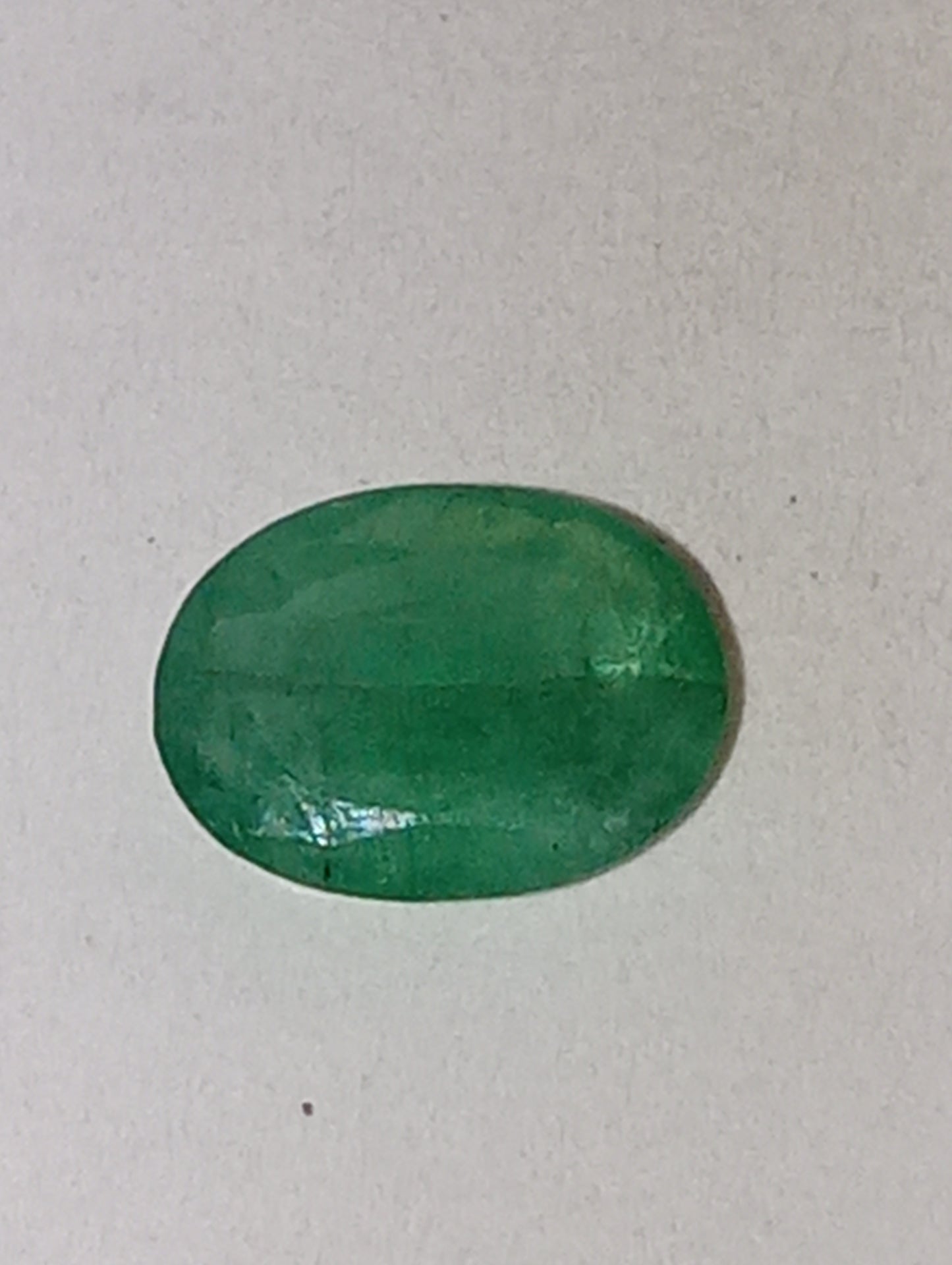 emerald gemstone, 7mmx5mm oval cut, .72ct