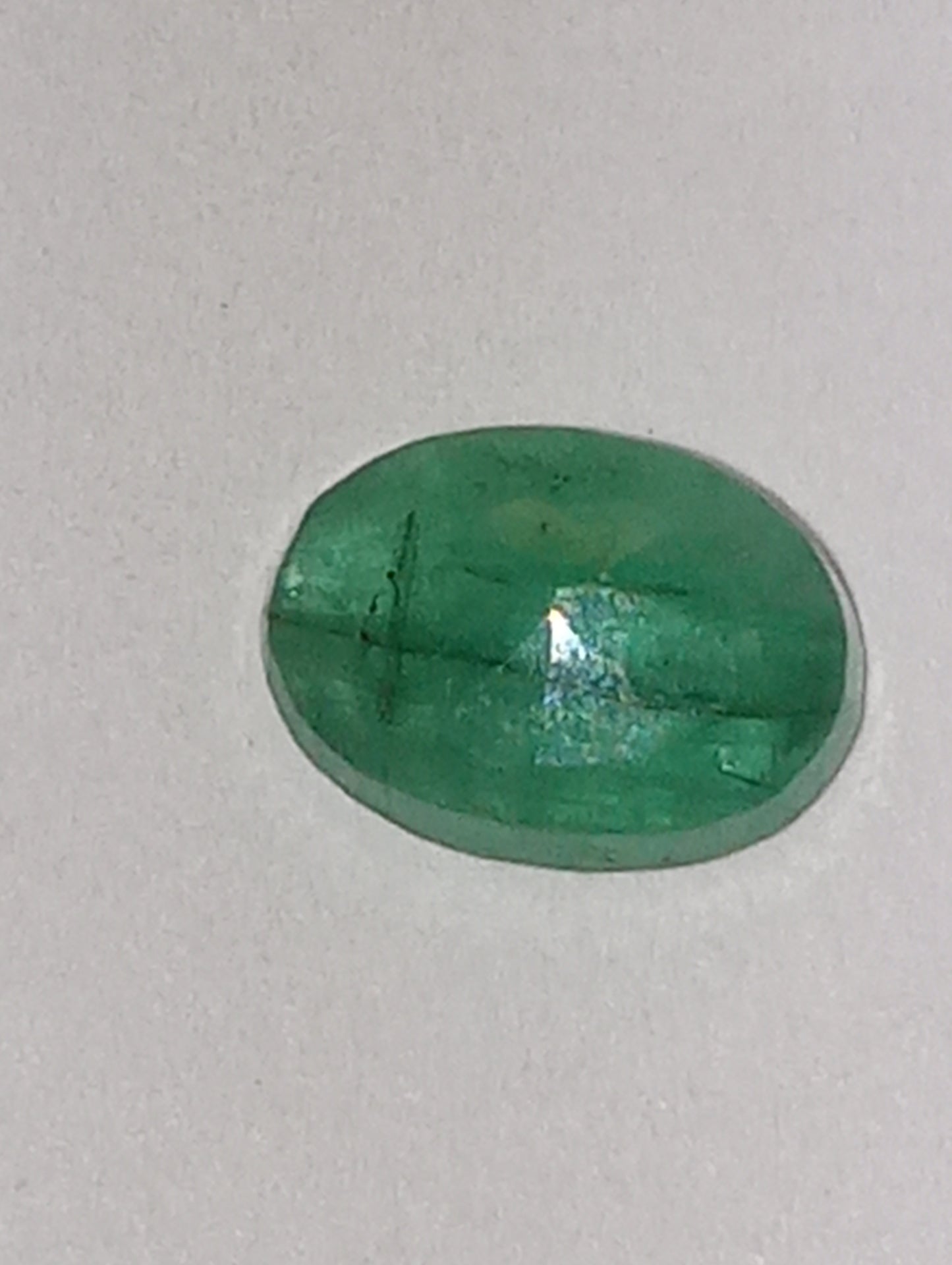 emerald gemstone, 7mmx5mm oval cut, .72ct