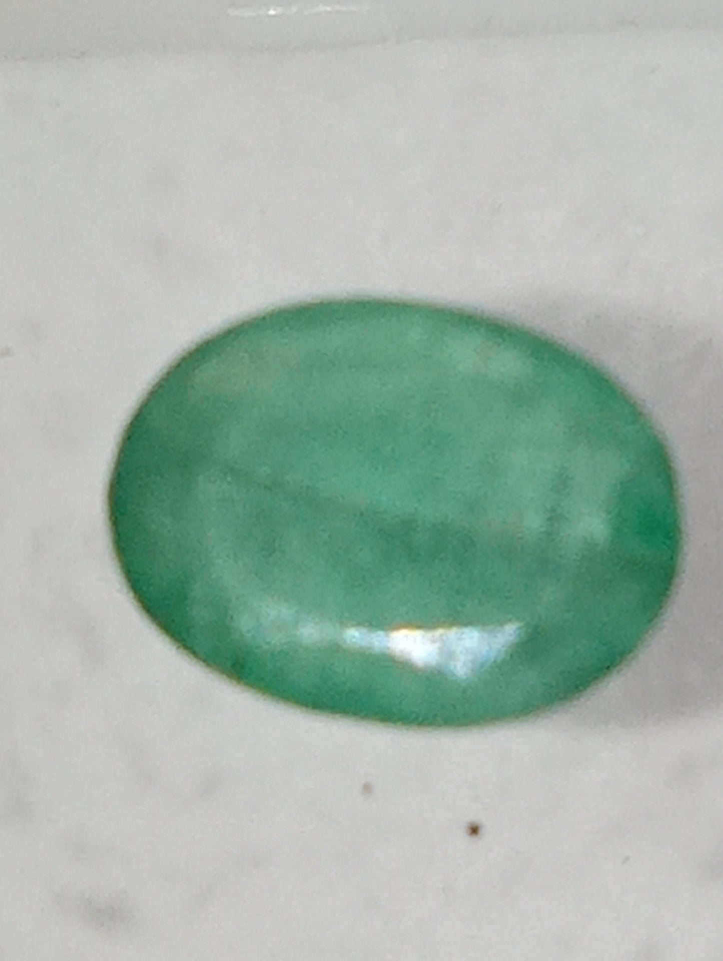 emerald gemstone, 7mmx5mm oval cut, .72ct