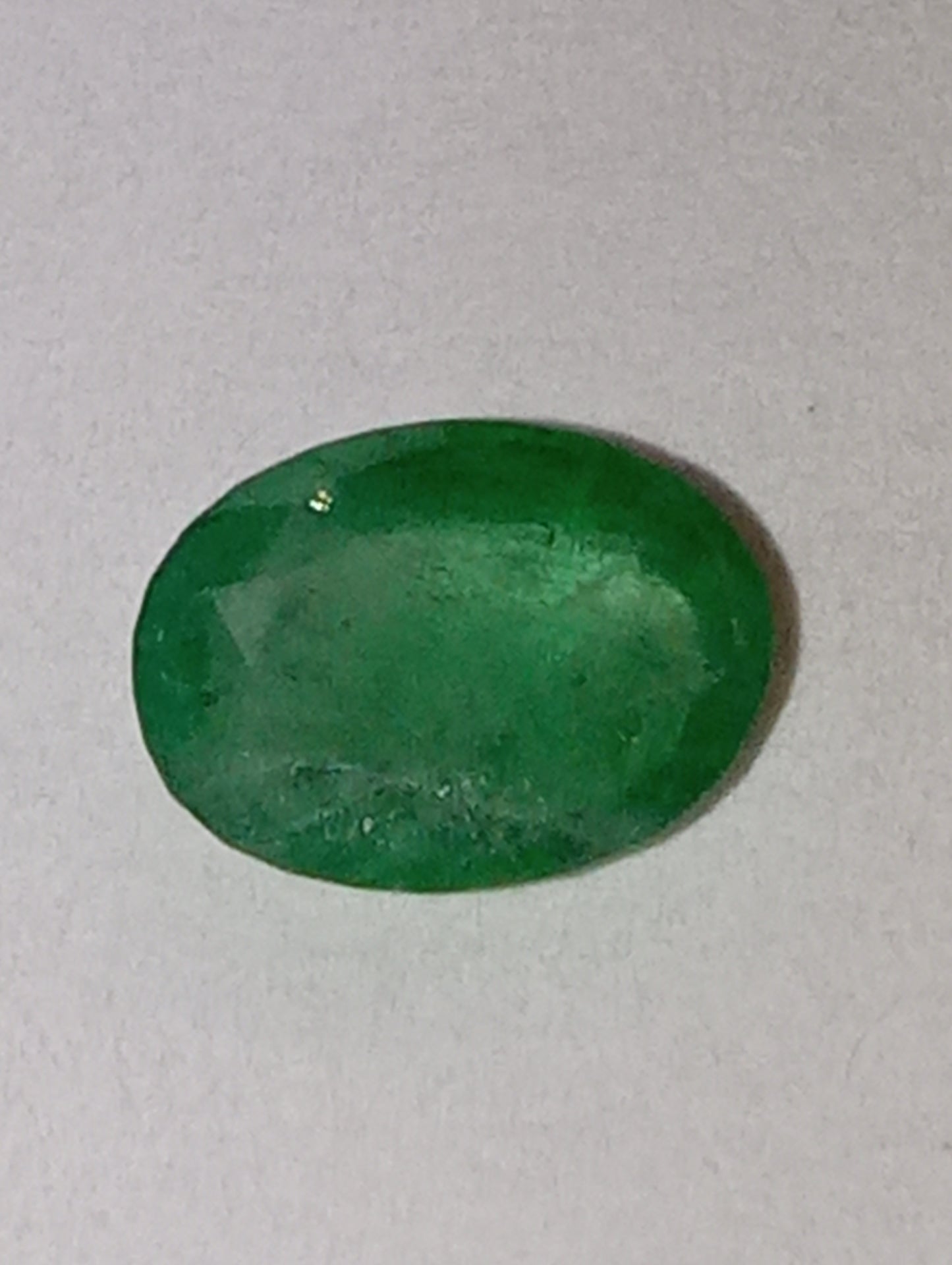 emerald gemstone, 7mmx5mm oval cut, .65ct