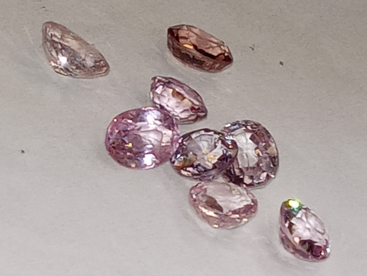 spinel gemstones, lavender and pinks, ovals and rounds, 8 stones, 4.38ctw
