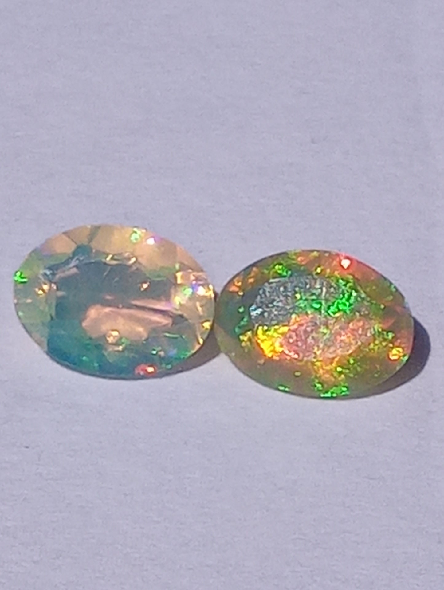 opal gemstone Ethiopian, 7mmx5mm faceted, oval cuts, 2 stones, .91ctw
