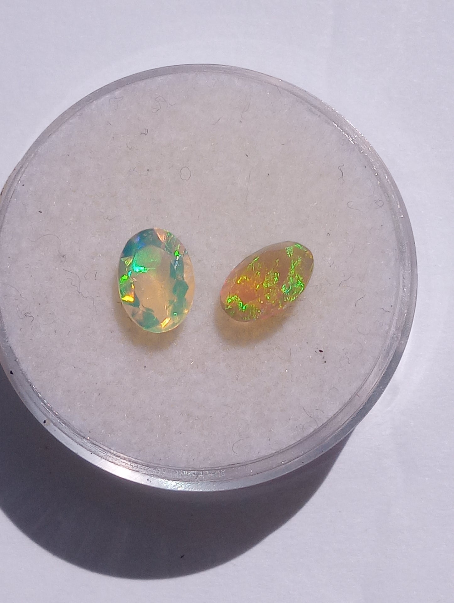 opal gemstone Ethiopian, 7mmx5mm faceted, oval cuts, 2 stones, .91ctw