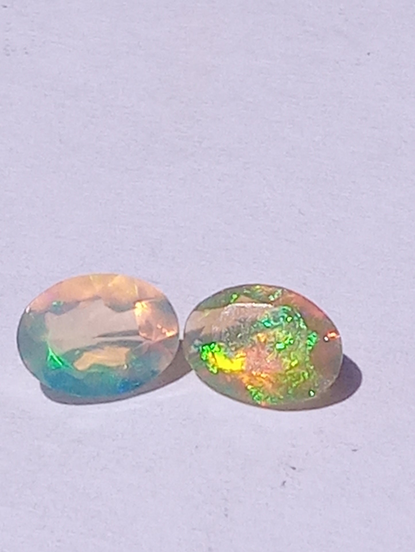 opal gemstone Ethiopian, 7mmx5mm faceted, oval cuts, 2 stones, .91ctw