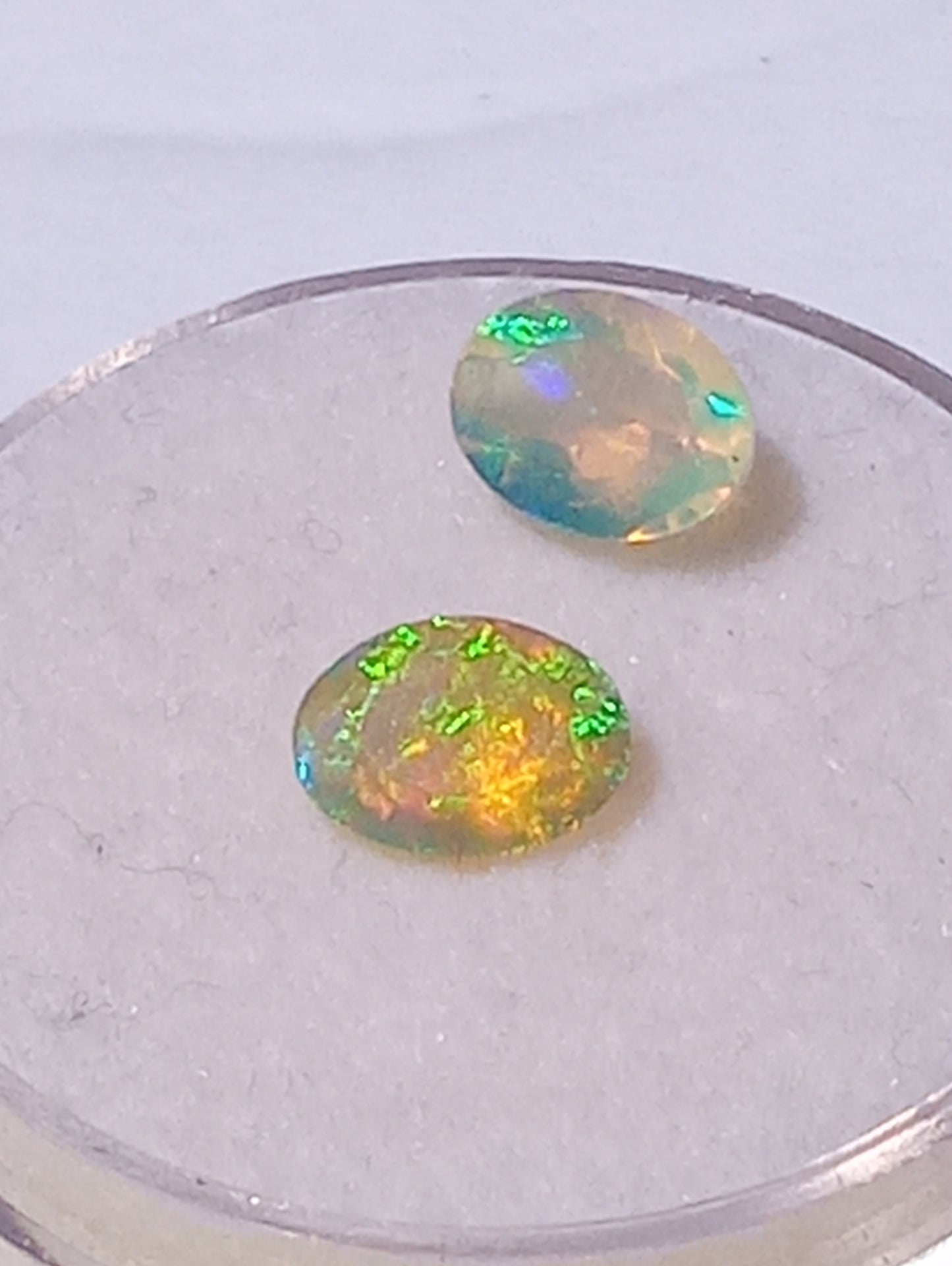opal gemstone Ethiopian, 7mmx5mm faceted, oval cuts, 2 stones, .91ctw