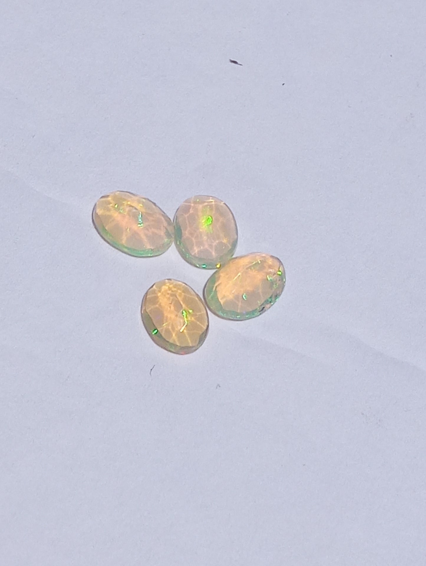 opal gemstones Ethiopian , faceted, 7mmx5mm oval cuts, 1.64ctw, 4 stones