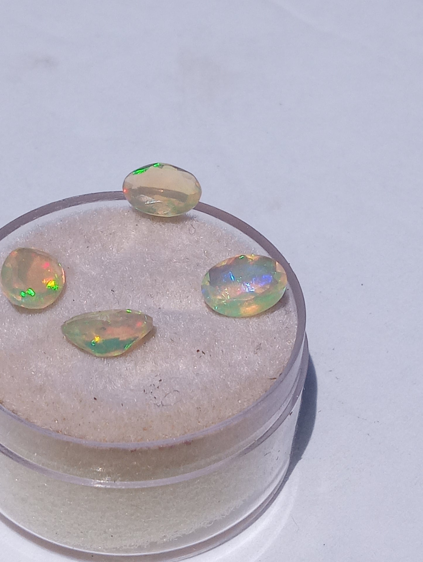 opal gemstones Ethiopian , faceted, 7mmx5mm oval cuts, 1.64ctw, 4 stones