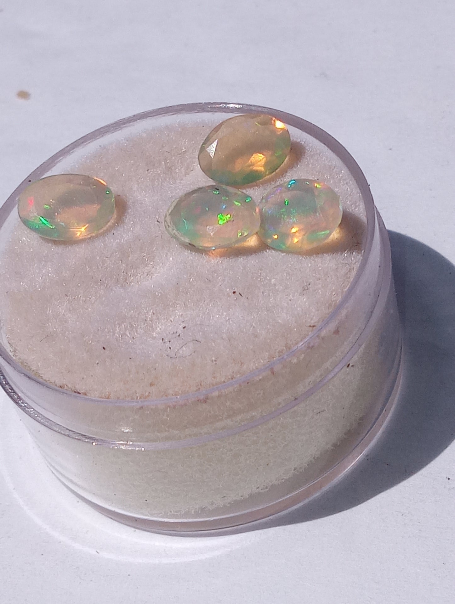 opal gemstones Ethiopian , faceted, 7mmx5mm oval cuts, 1.64ctw, 4 stones