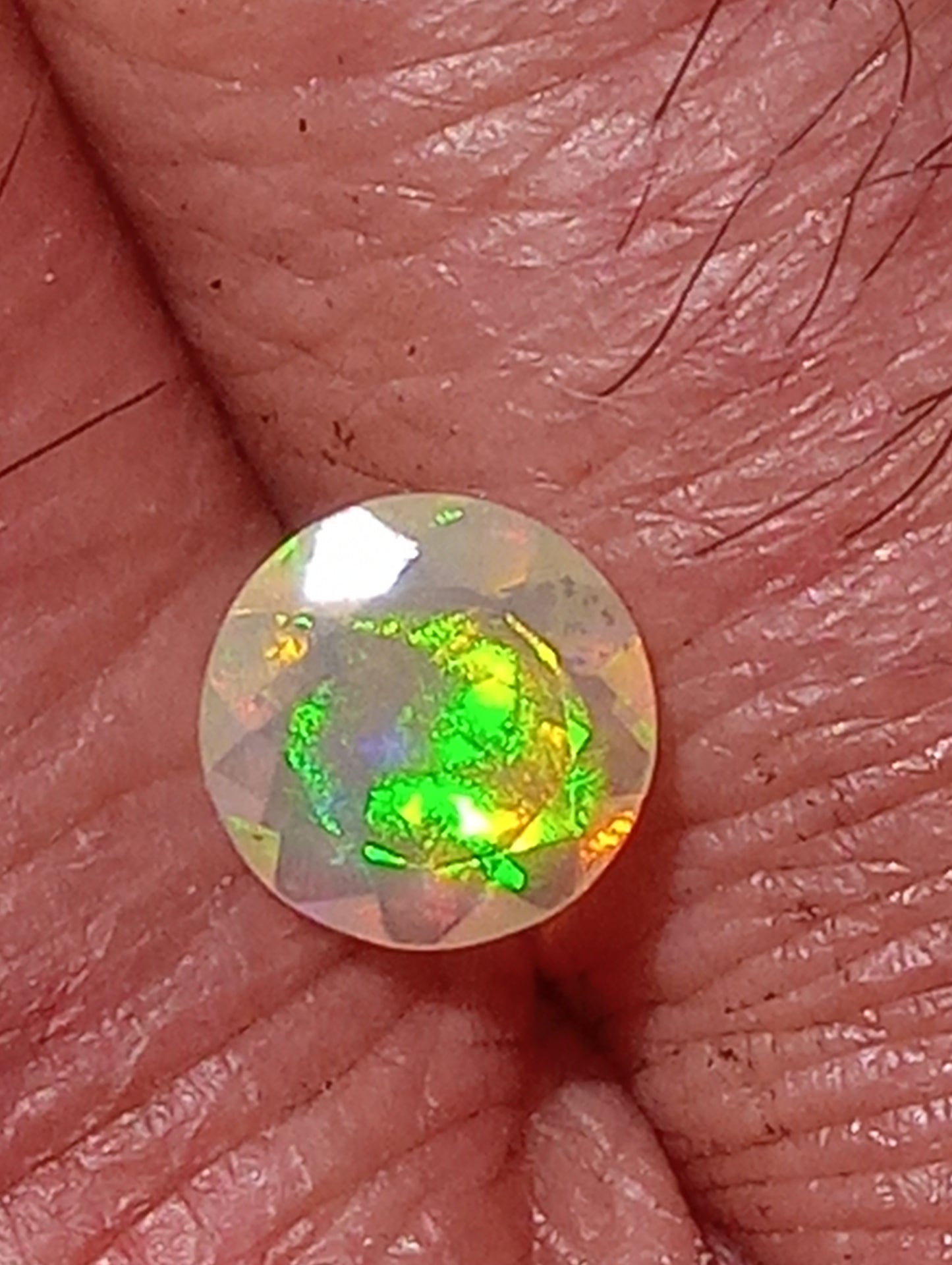opal gemstone Ethiopian, faceted 7mm round cut, .61ct