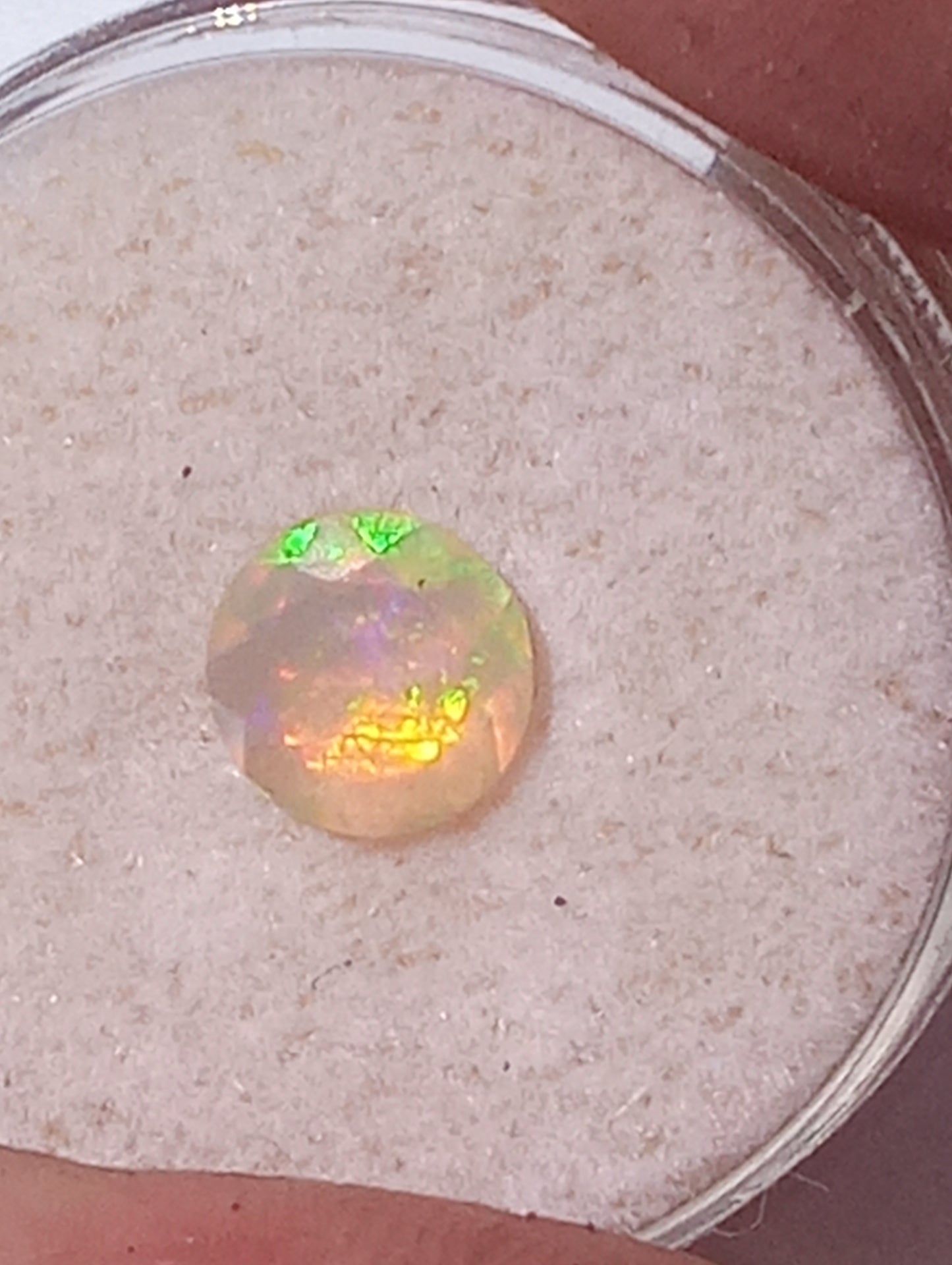 opal gemstone Ethiopian, faceted 7mm round cut, .61ct