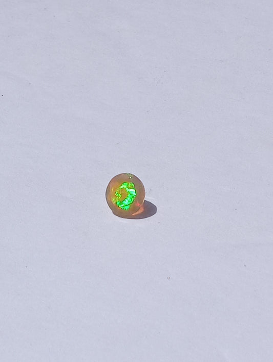 opal gemstone Ethiopian, faceted 7mm round cut, .79ct