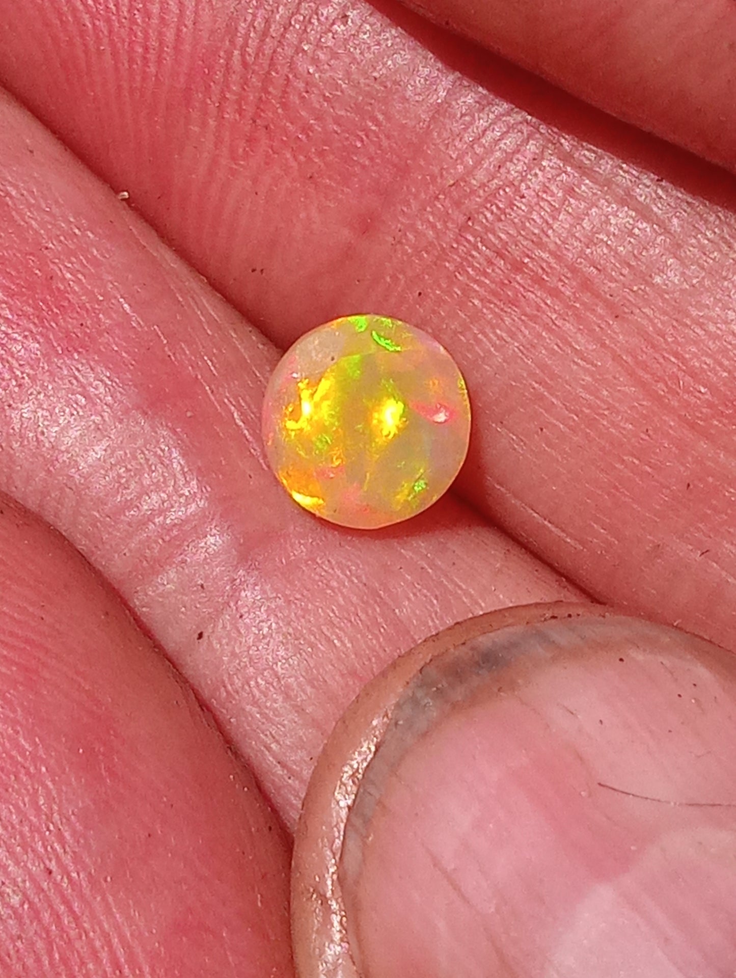 opal gemstone Ethiopian, faceted 7mm round cut, .79ct