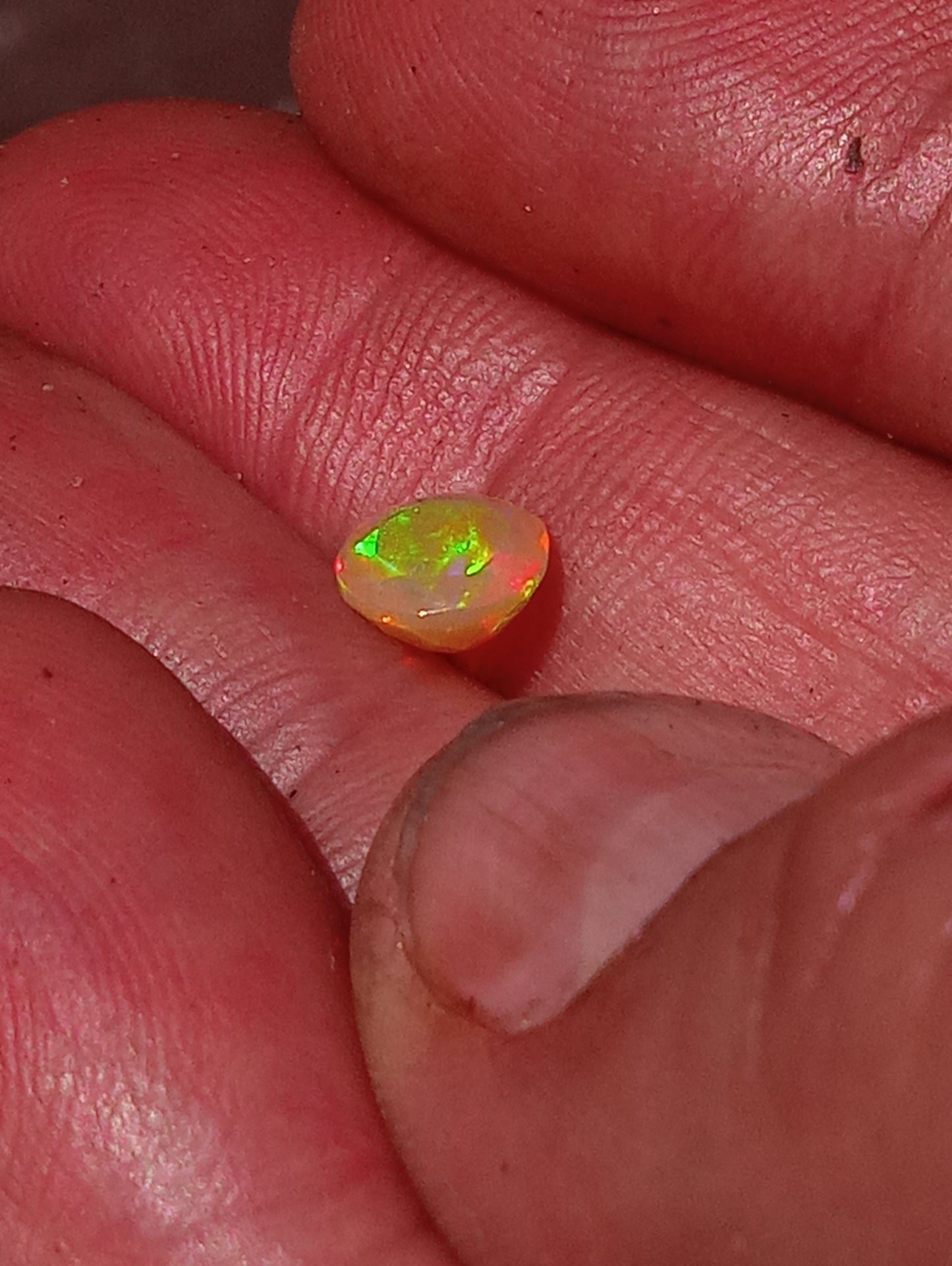 opal gemstone Ethiopian, faceted  9mmx7mm oval cut, .82ct