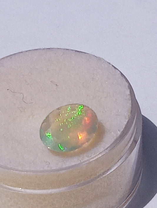 opal gemstone Ethiopian, faceted  9mmx7mm oval cut, .82ct