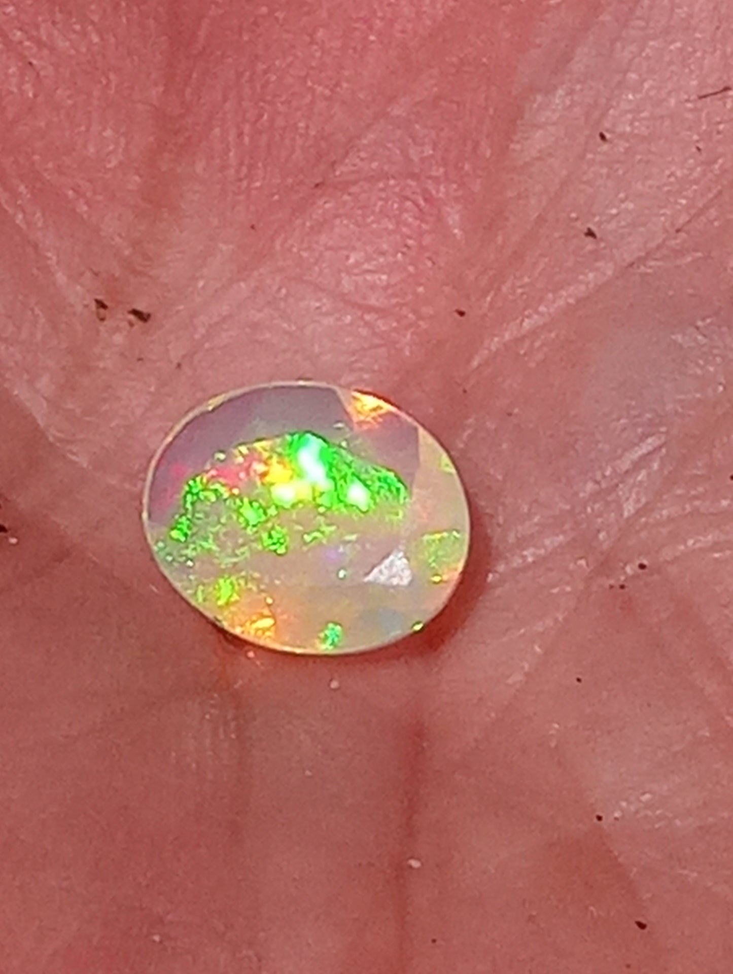 opal gemstone Ethiopian, faceted  9mmx7mm oval cut, .82ct