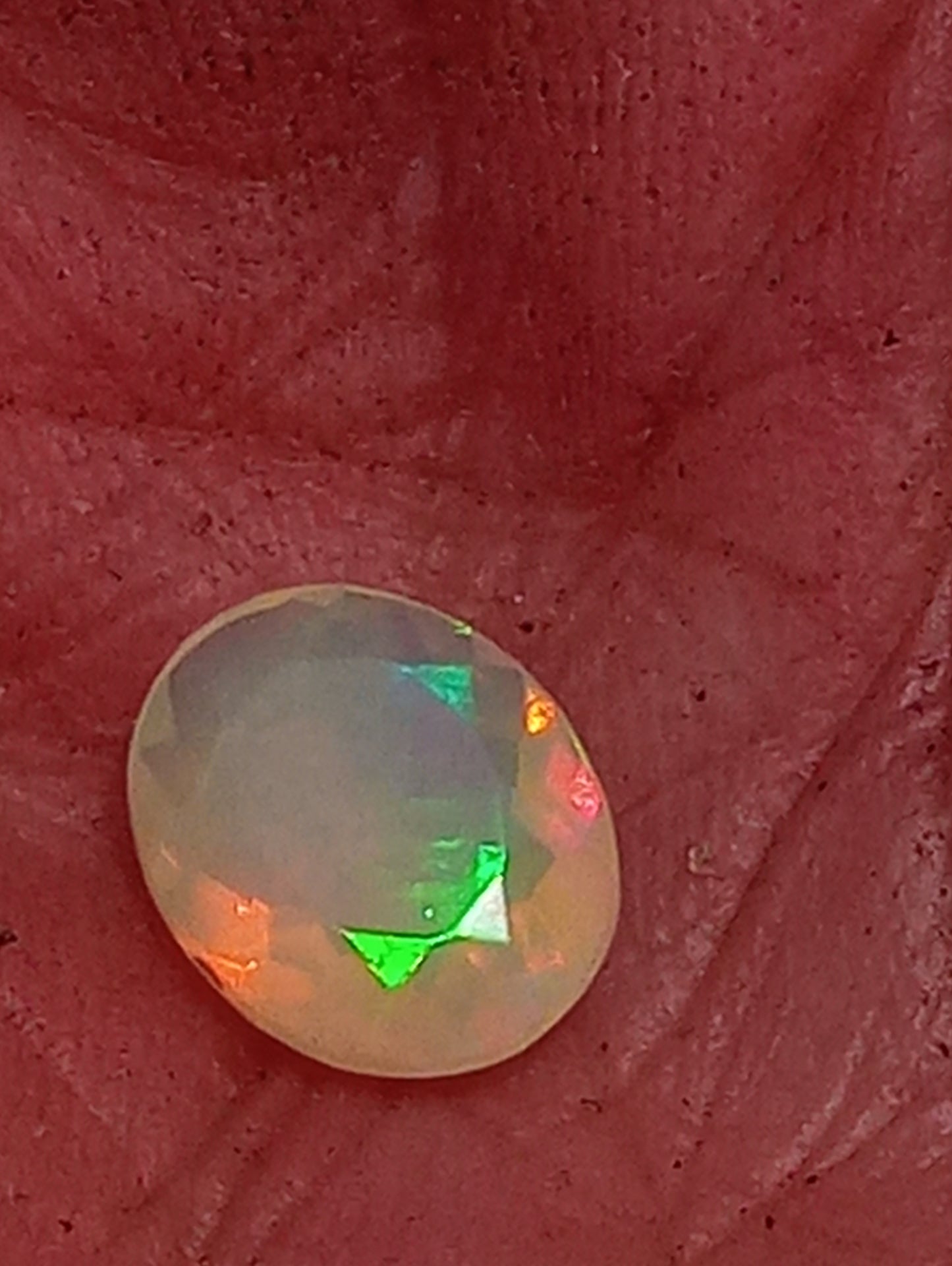 opal gemstone Ethiopian, faceted 10mmx8mm oval cut, 1.09ct