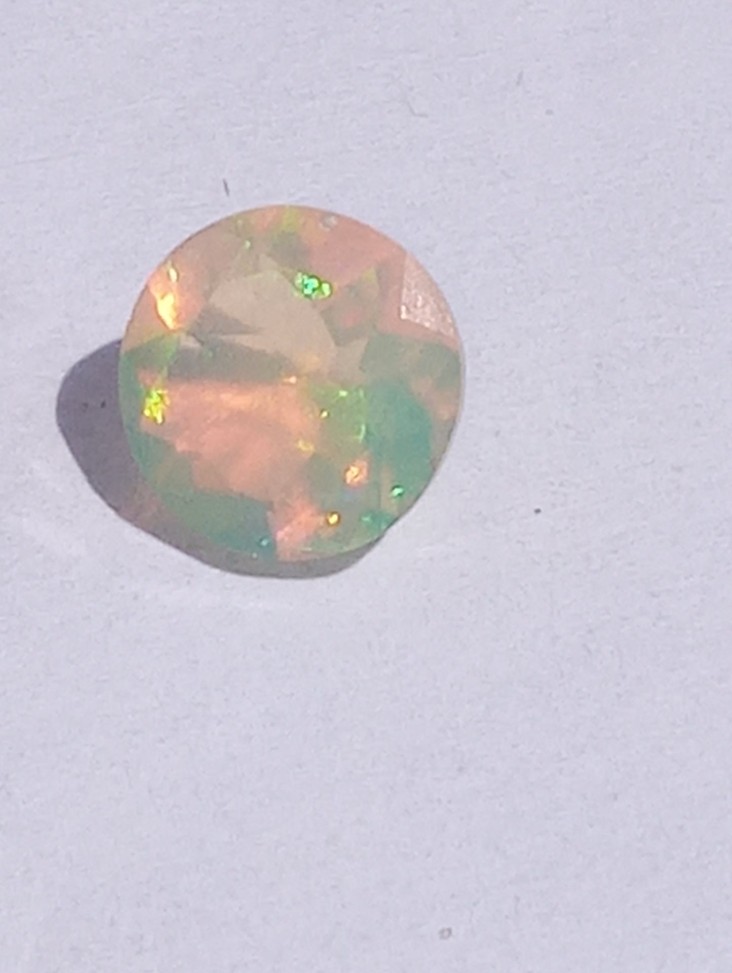 opal gemstones Ethiopian, faqceted, 7mm round cut, .76ct
