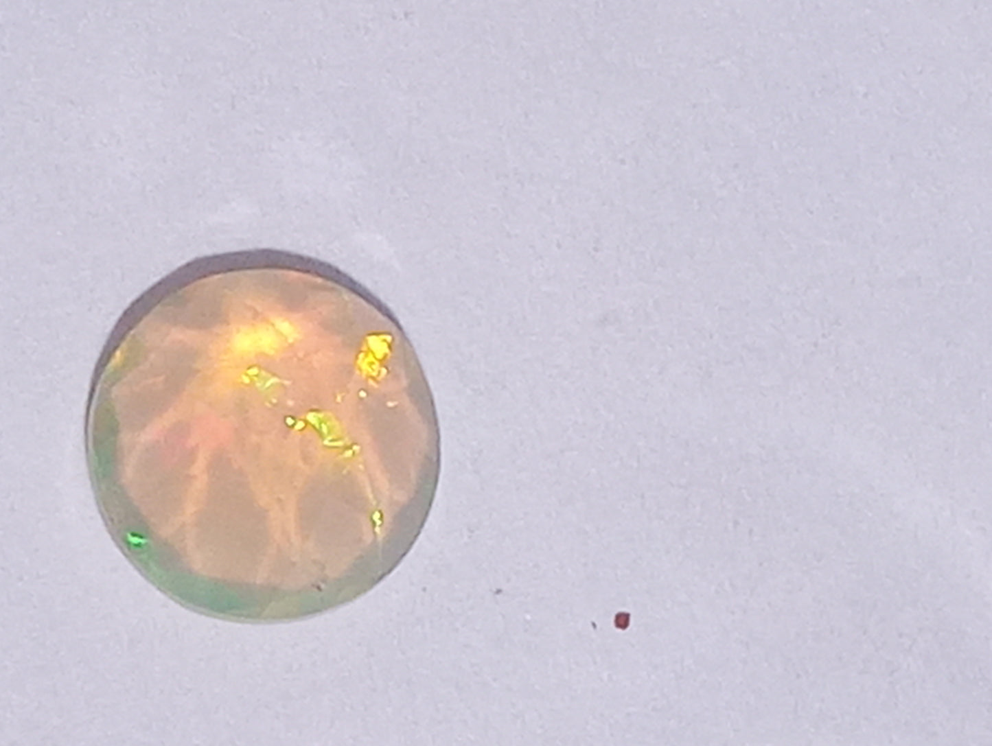 opal gemstones Ethiopian, faqceted, 7mm round cut, .76ct