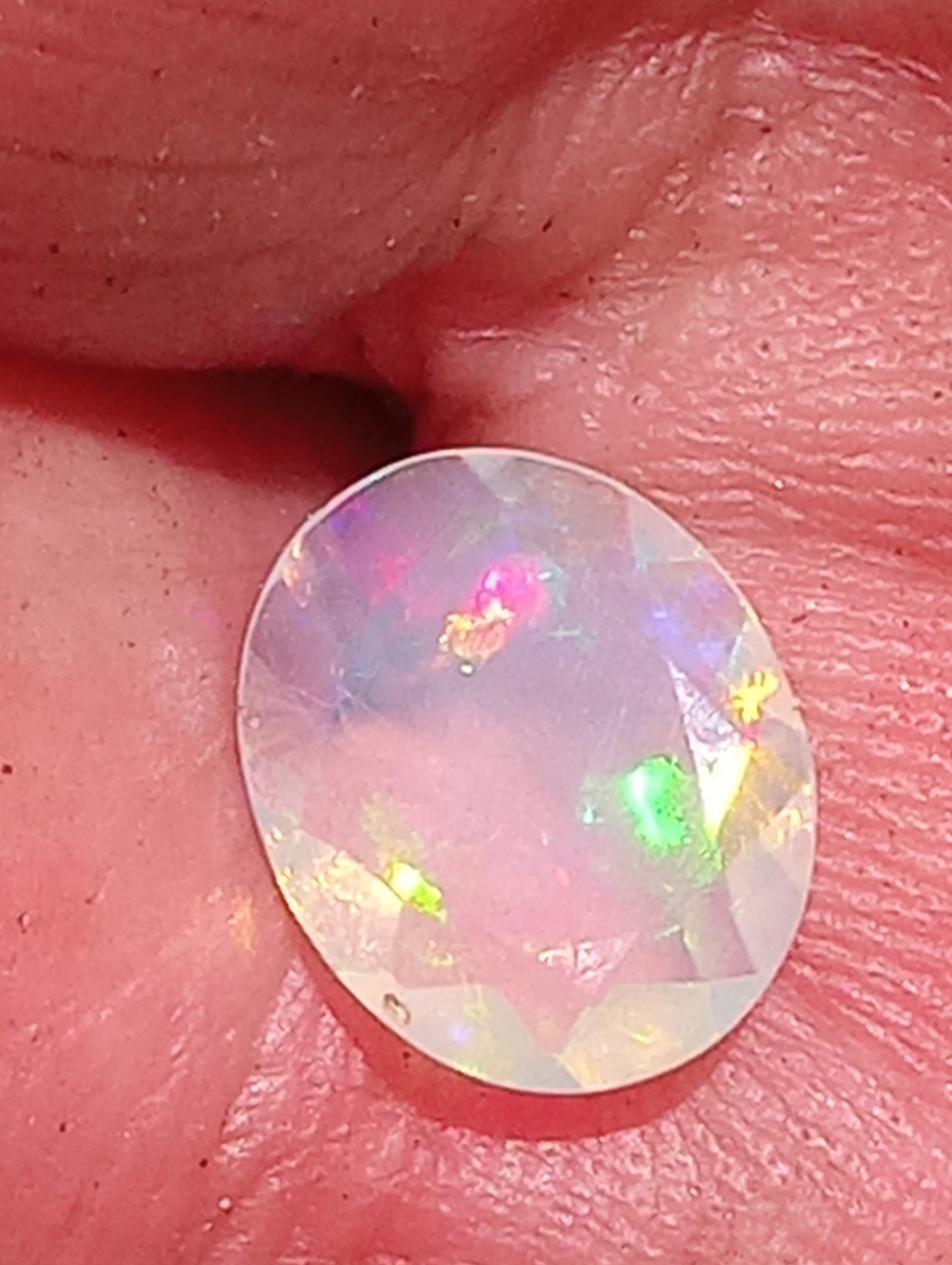 opal gemstone Ethiopian, faceted 10mmx8mm oval cut, 1.08cty