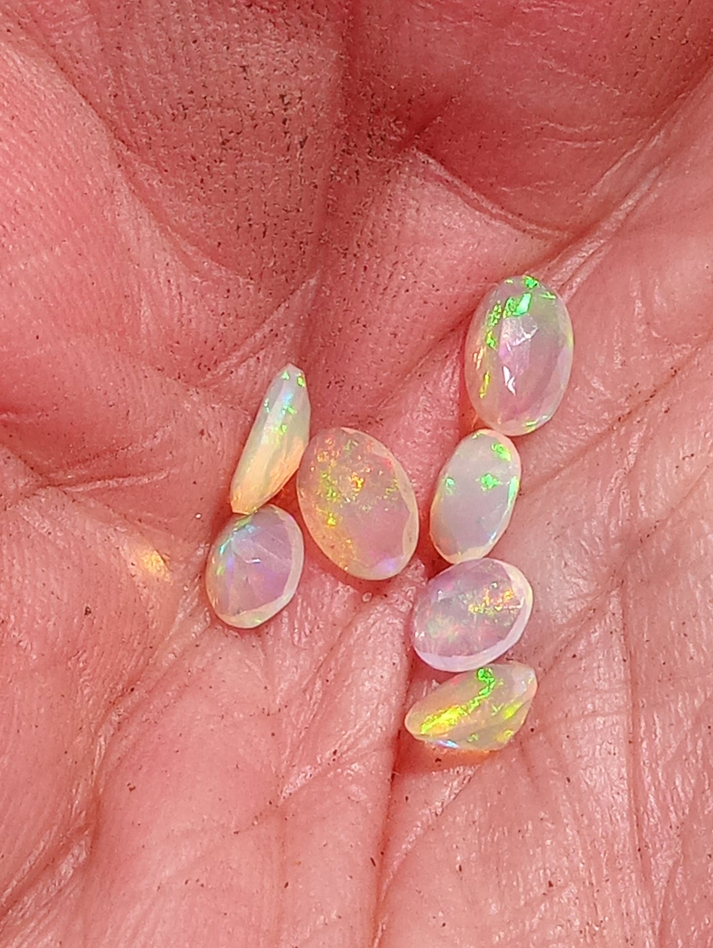 opal gemstone Ethiopian, faceted 6mmx4mm oval cuts, 7 stones