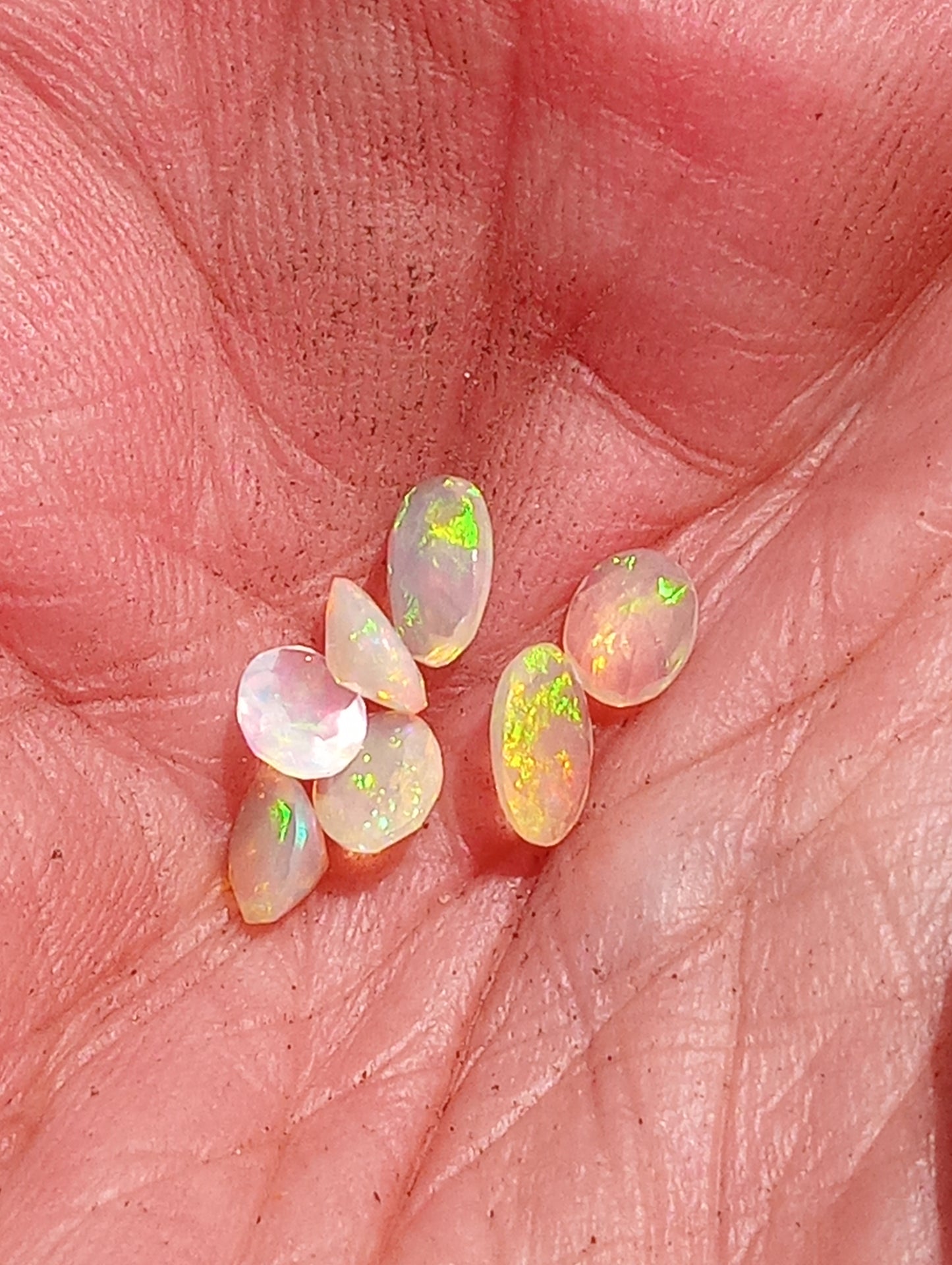 opal gemstone Ethiopian, faceted 6mmx4mm oval cuts, 7 stones