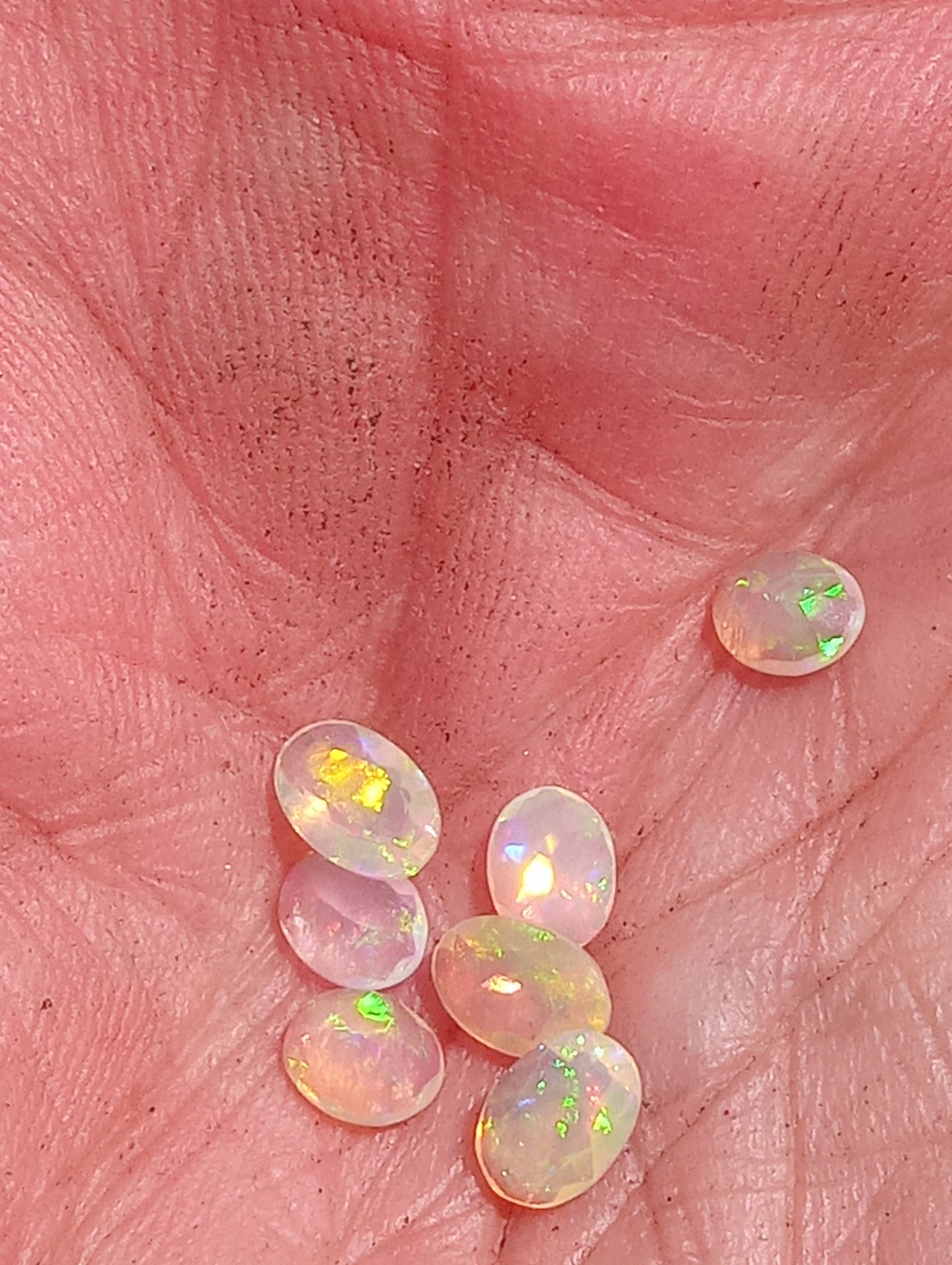 opal gemstone Ethiopian, faceted 6mmx4mm oval cuts, 7 stones