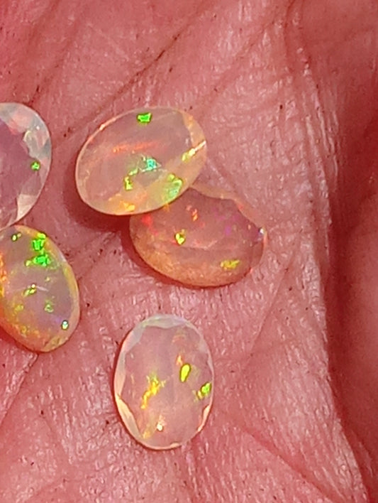 opal gemstone Ethiopian, faceted 7mmx5mm oval cuts, 5 stones