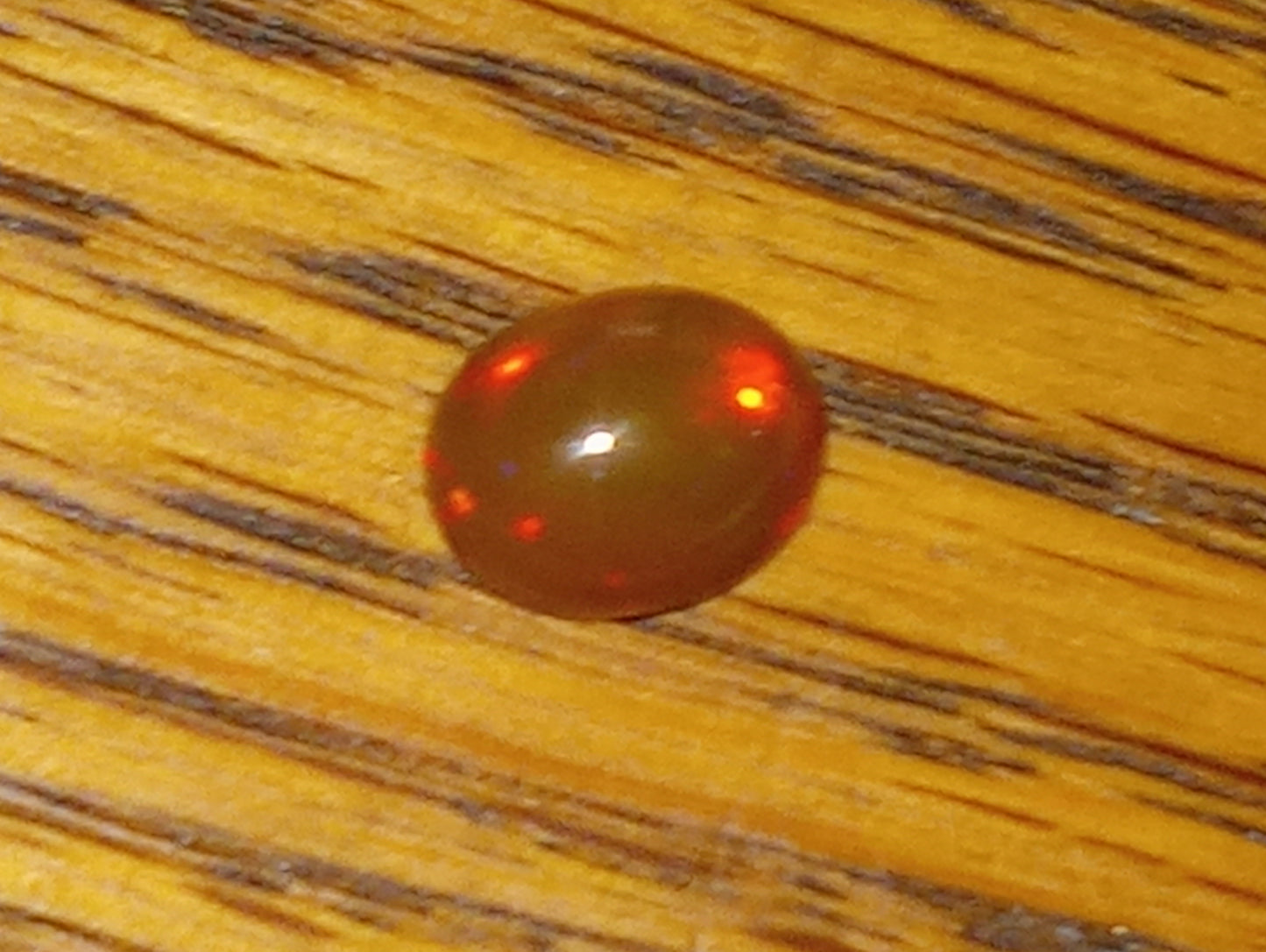 opal gemstone Ethiopian 9mmx7mm oval cab, 1.50ct