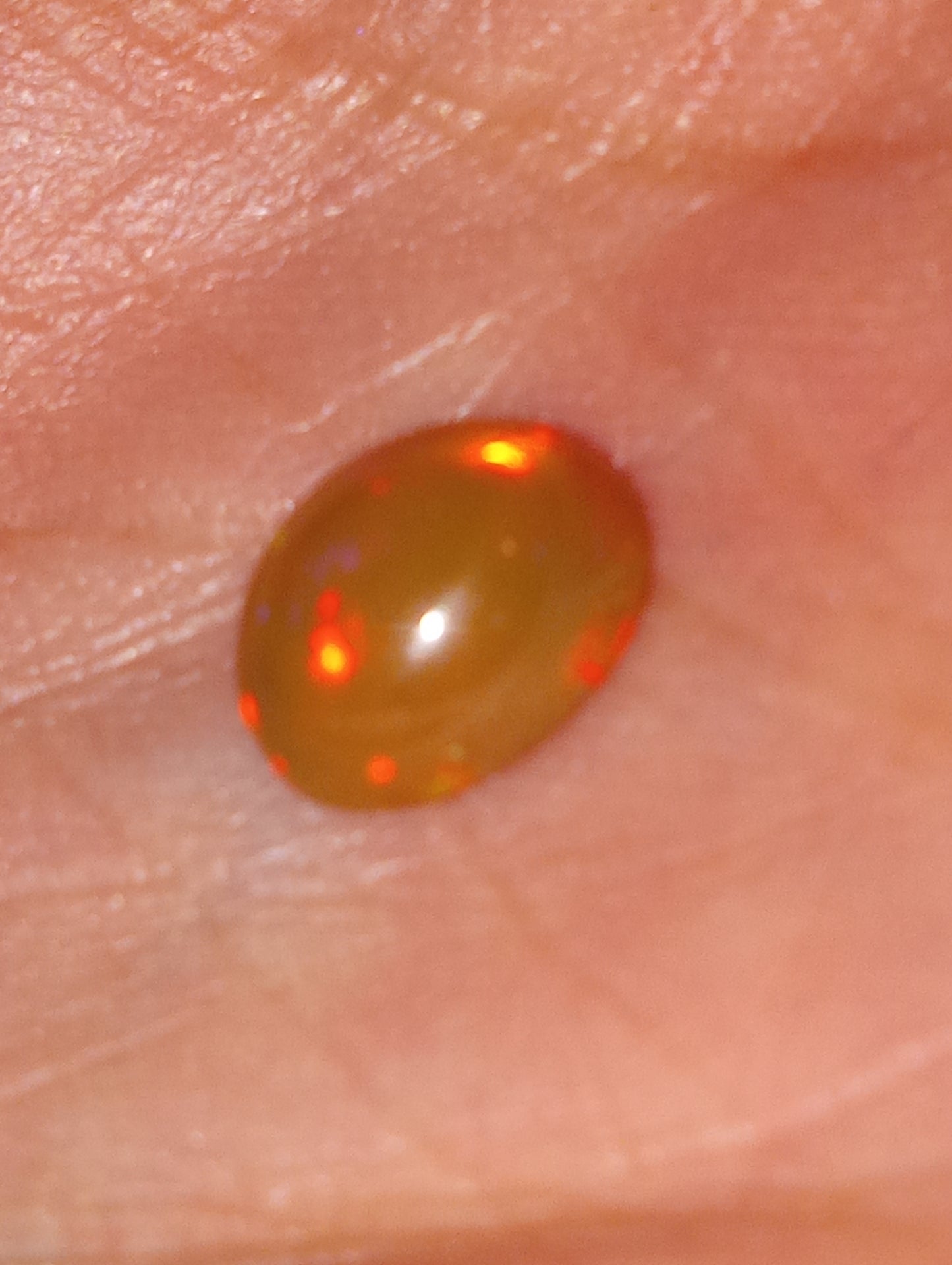opal gemstone Ethiopian 9mmx7mm oval cab, 1.50ct