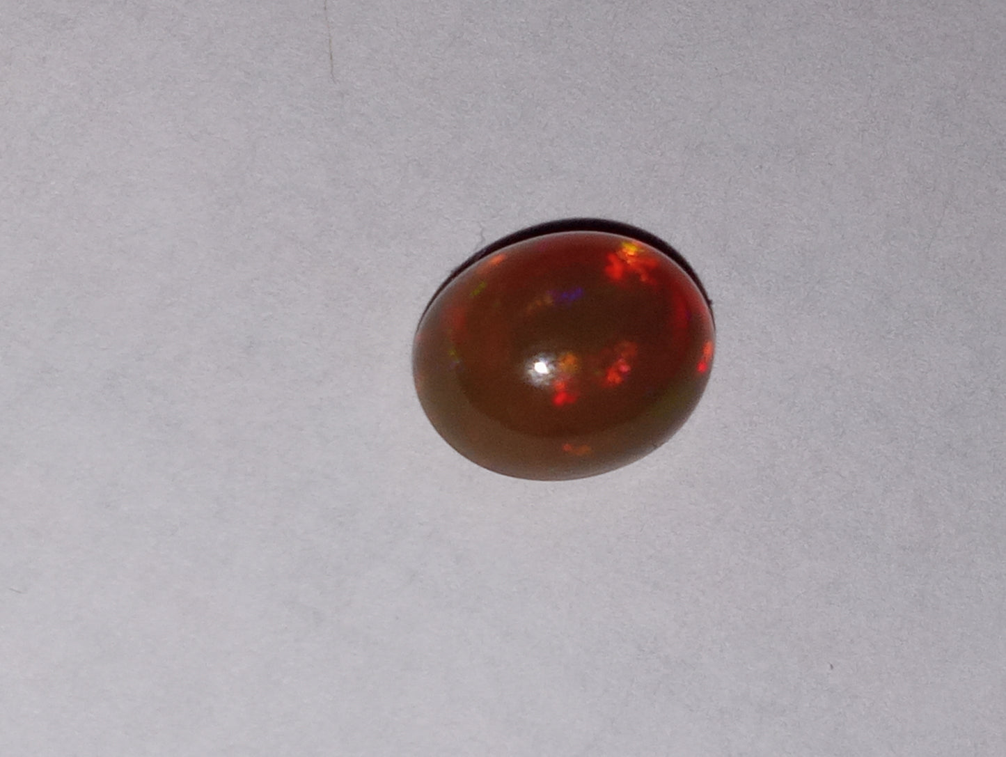 opal gemstone Ethiopian 9mmx7mm oval cab, 1.50ct