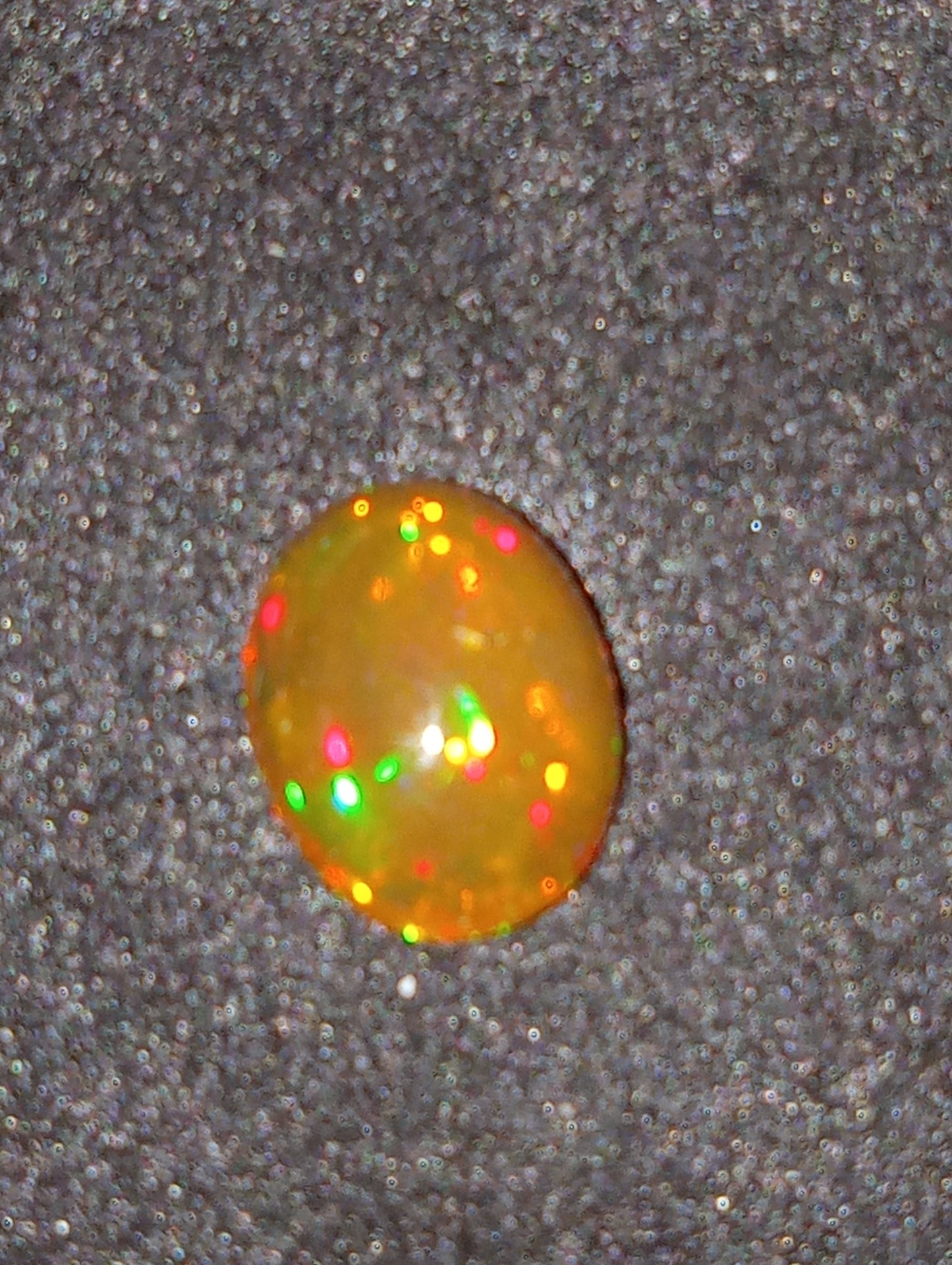 opal gemstone Ethiopian, 9mmx7mm oval cabacon, 1.24ct
