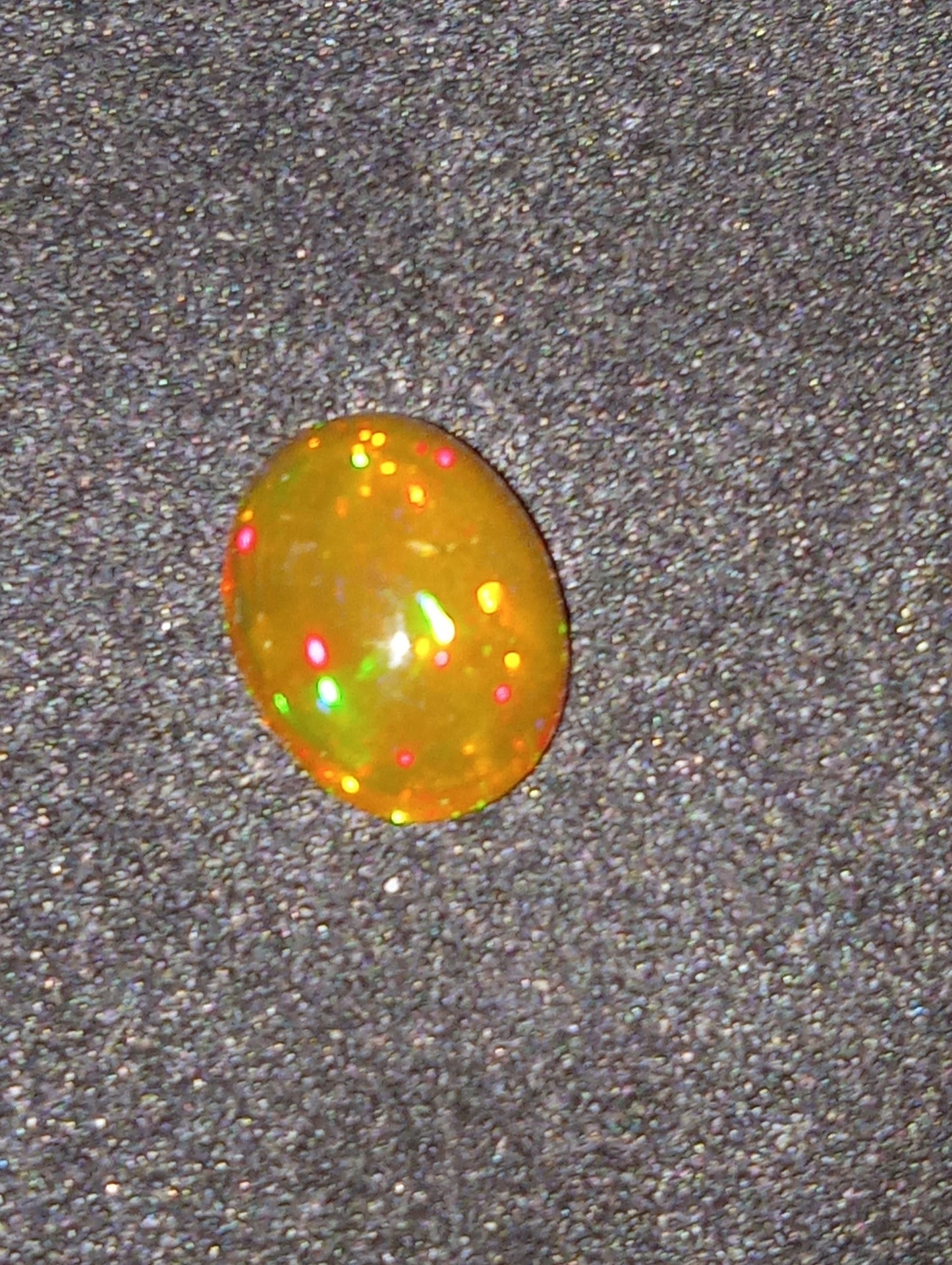 opal gemstone Ethiopian, 9mmx7mm oval cabacon, 1.24ct