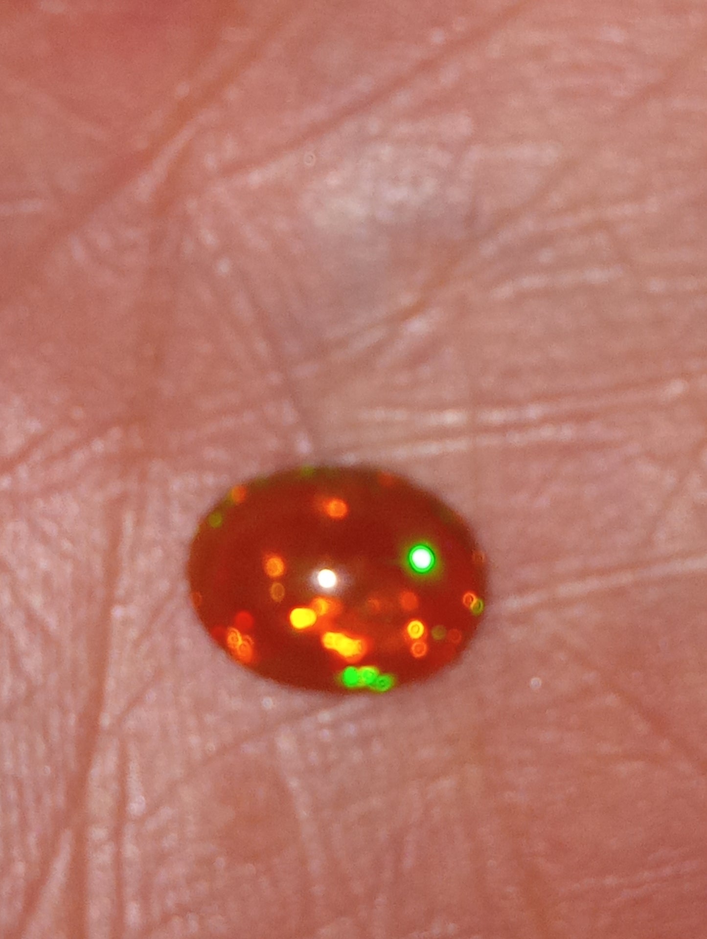 opal gemstone Ethiopian, 9mmx7mm oval cabacon, 1.24ct