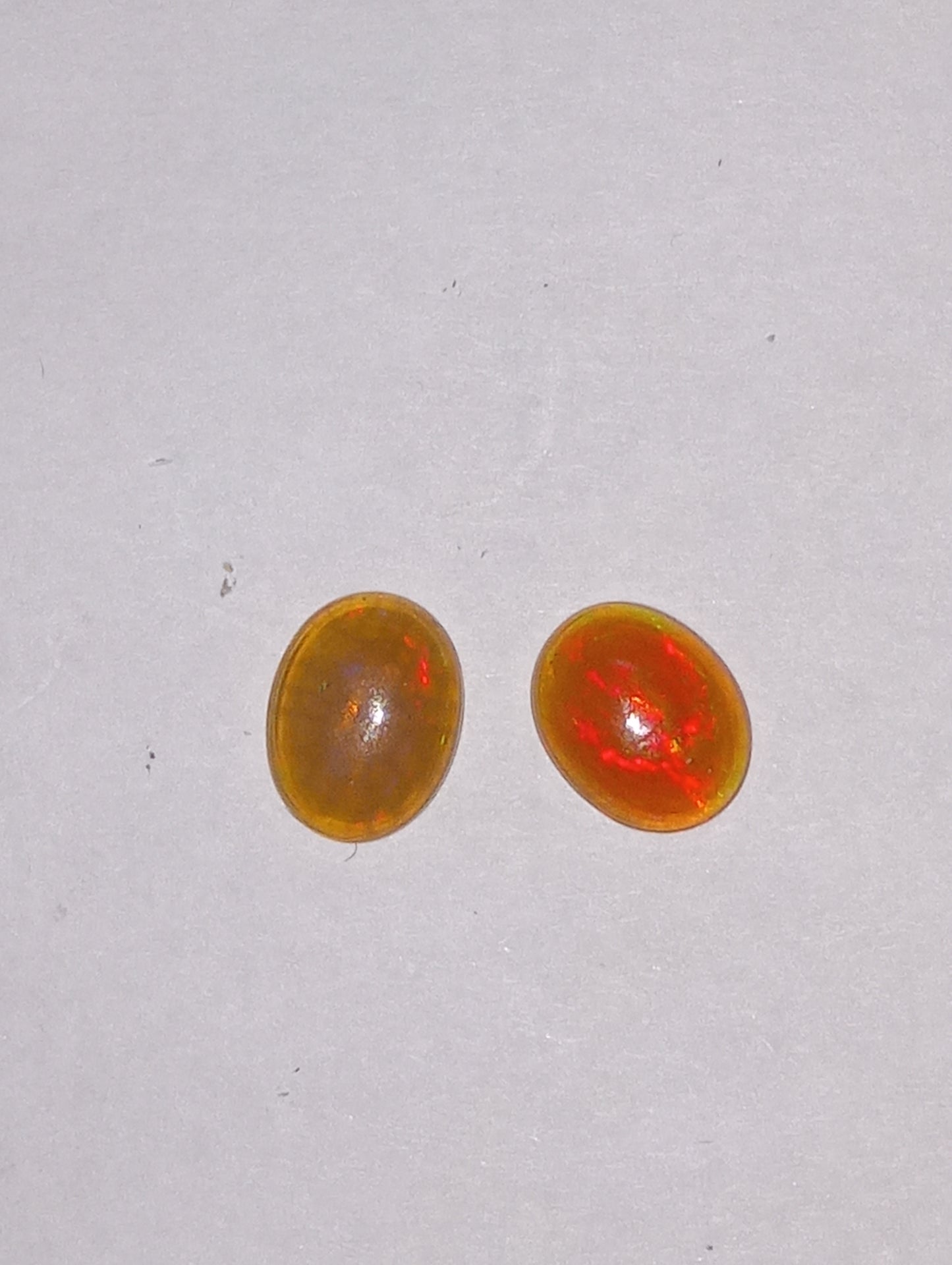 opal Ethiopian , 9mmx7mm cabacons, 2 stones , 1.77ctw