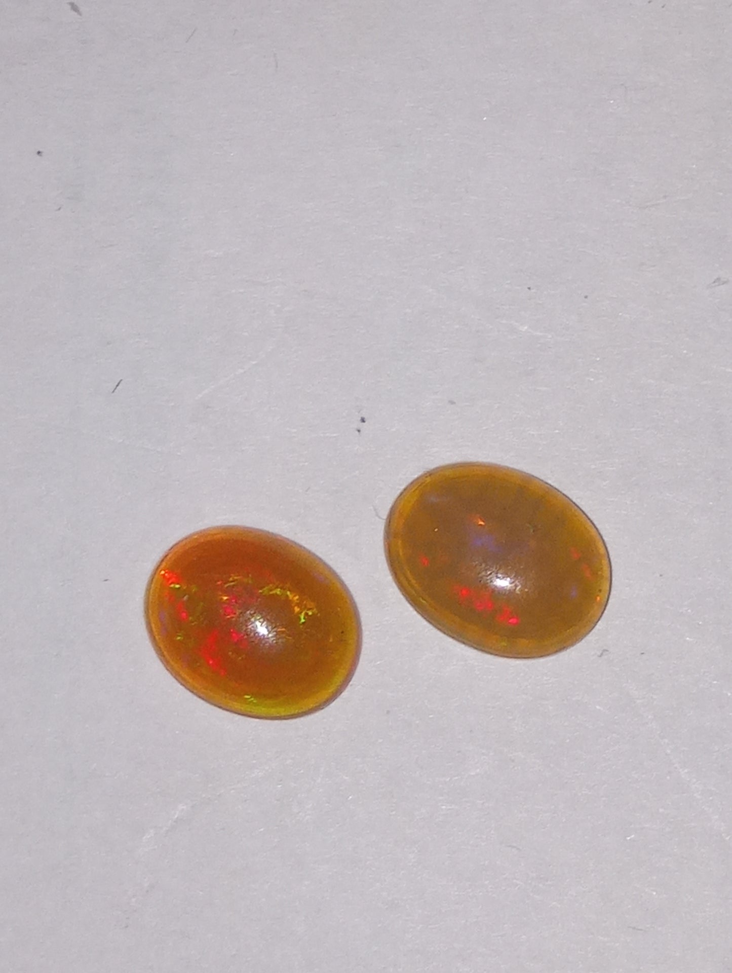 opal Ethiopian , 9mmx7mm cabacons, 2 stones , 1.77ctw