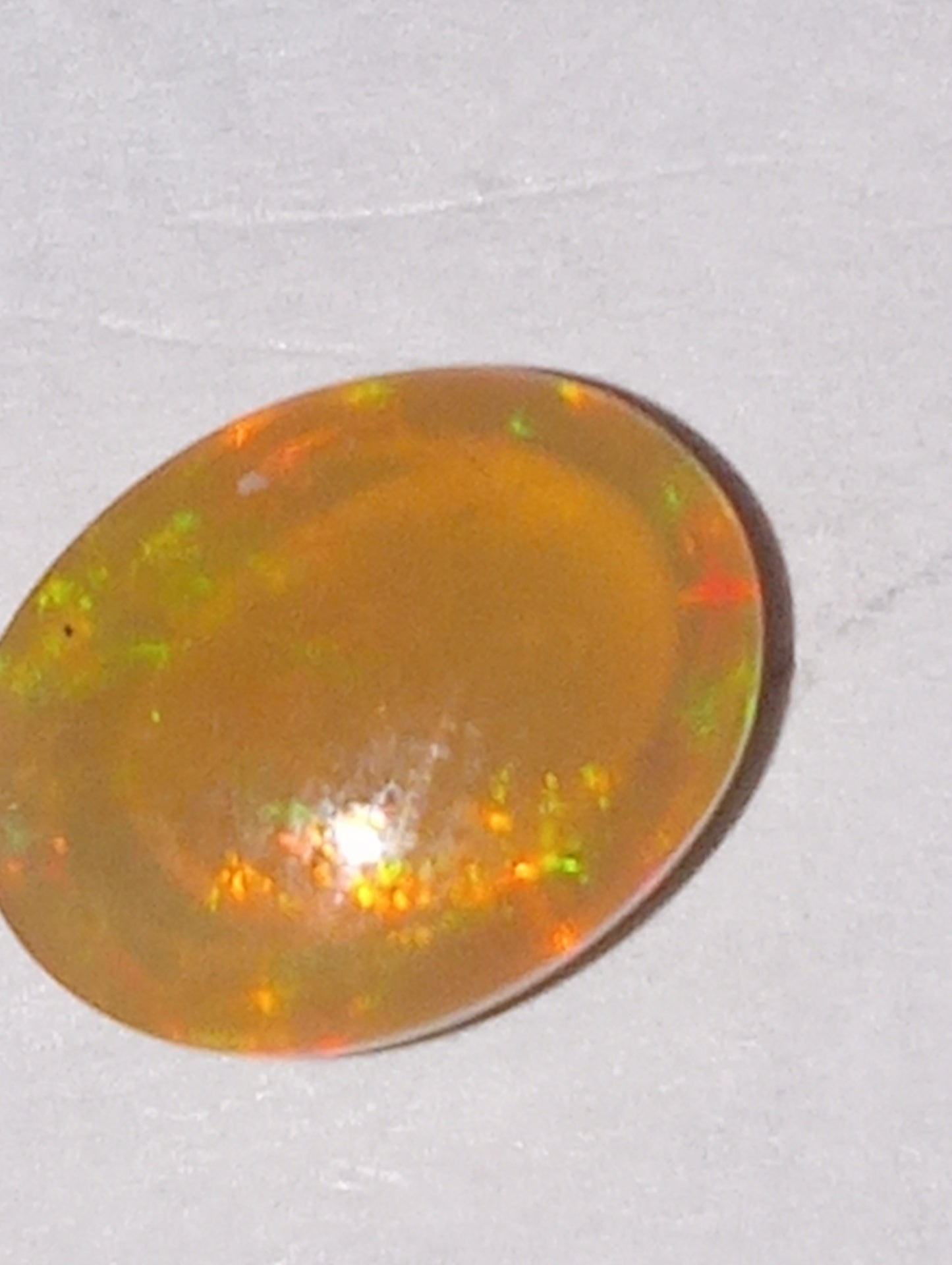 opal gemstone Ethiopian, 9mmx7mm oval,   1.26ct