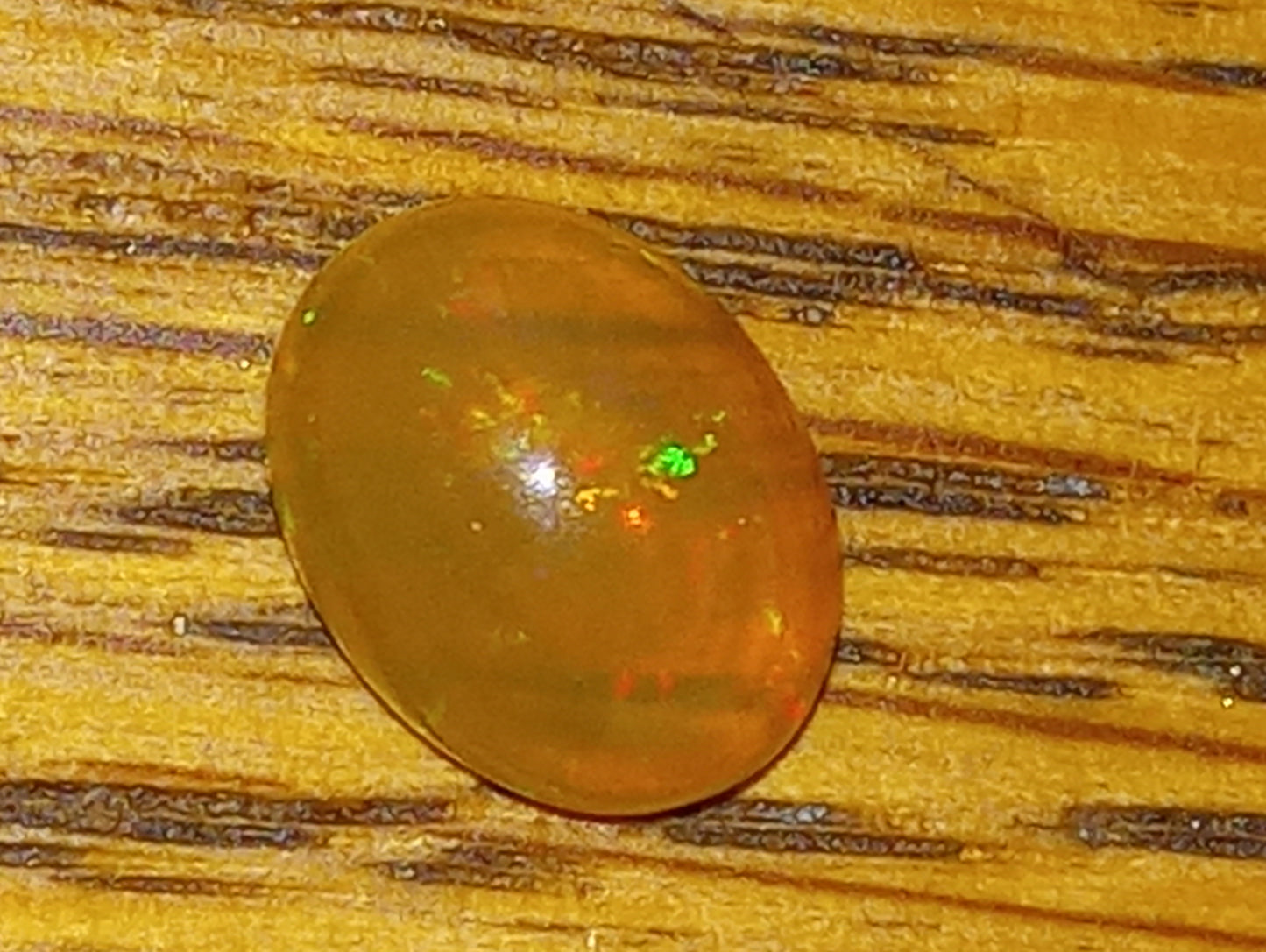 opal gemstone Ethiopian, 9mmx7mm oval,   1.26ct