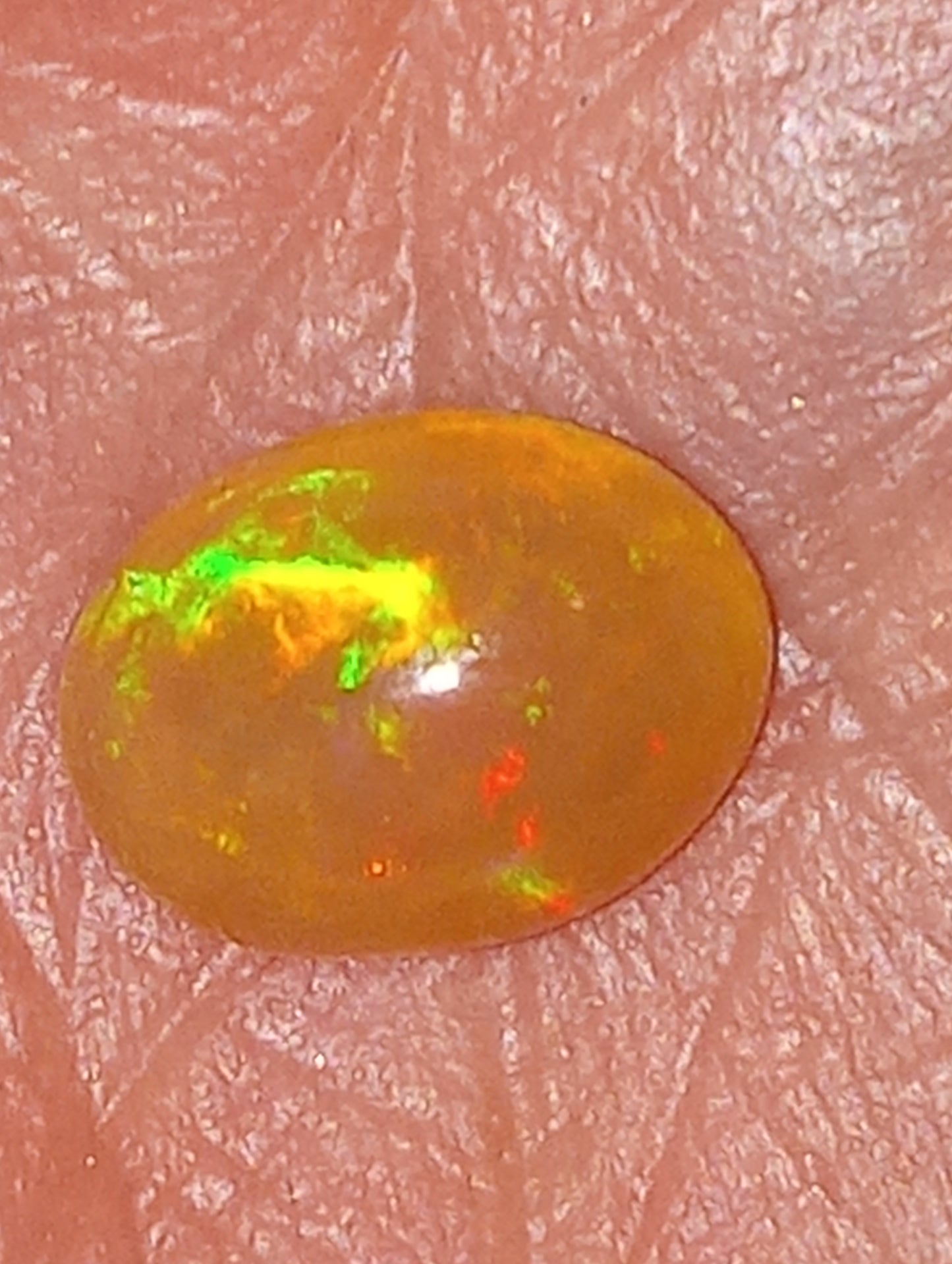 opal gemstone Ethiopian, 9mmx7mm oval,   1.26ct