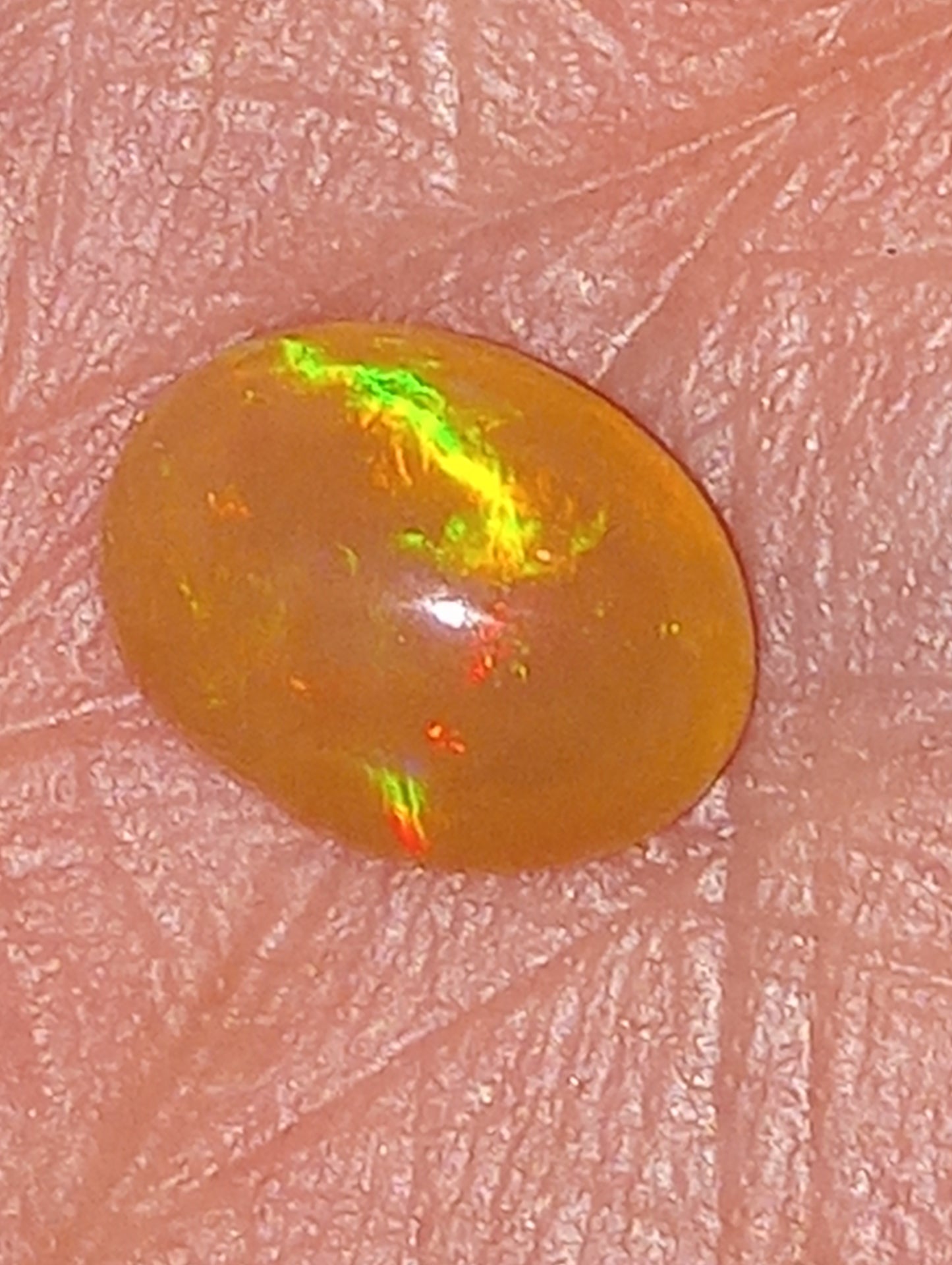 opal gemstone Ethiopian, 9mmx7mm oval,   1.26ct