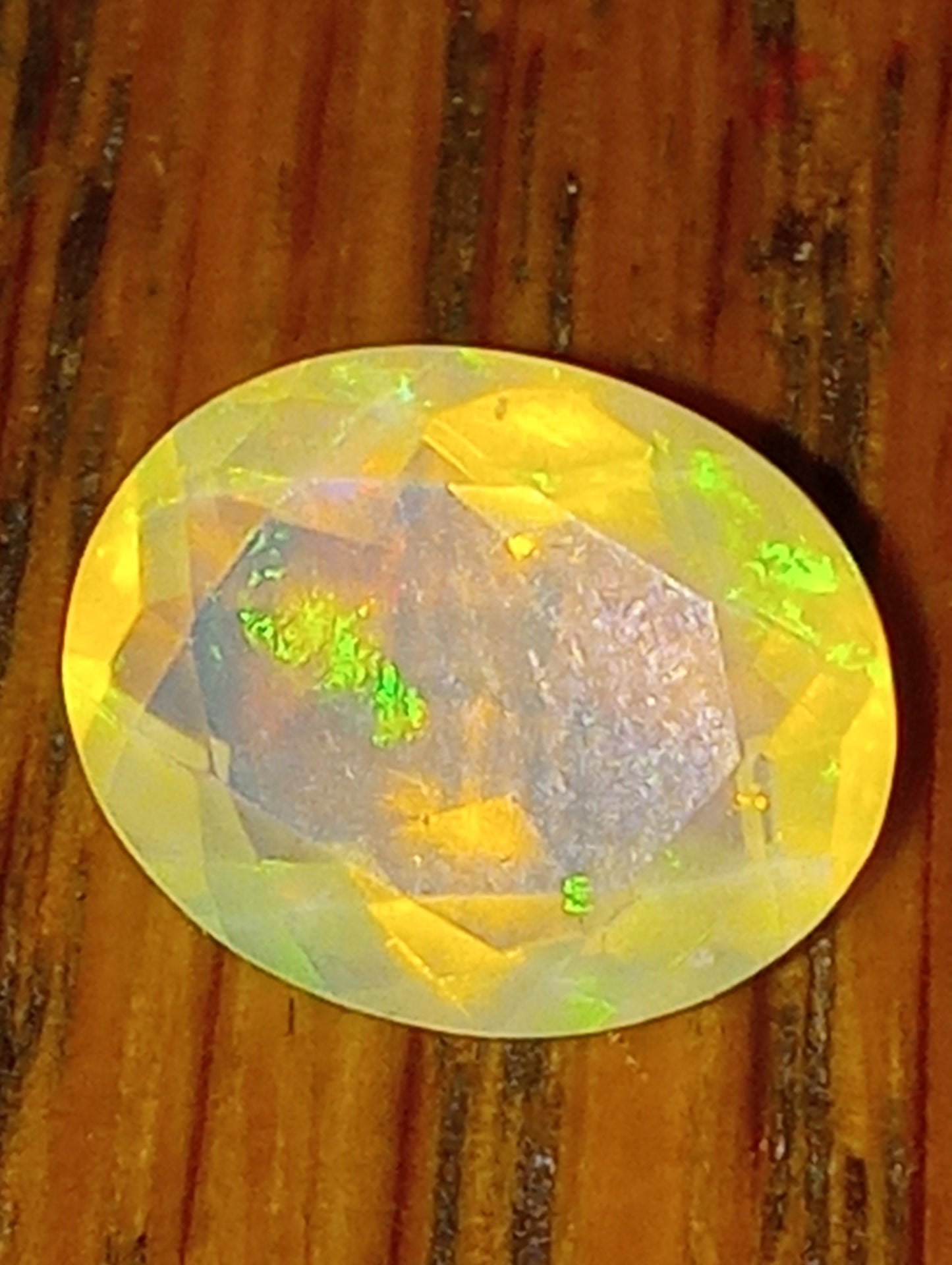opal gemstone Ethiopian , faceted, 10mmx8mm oval, 1.83ct