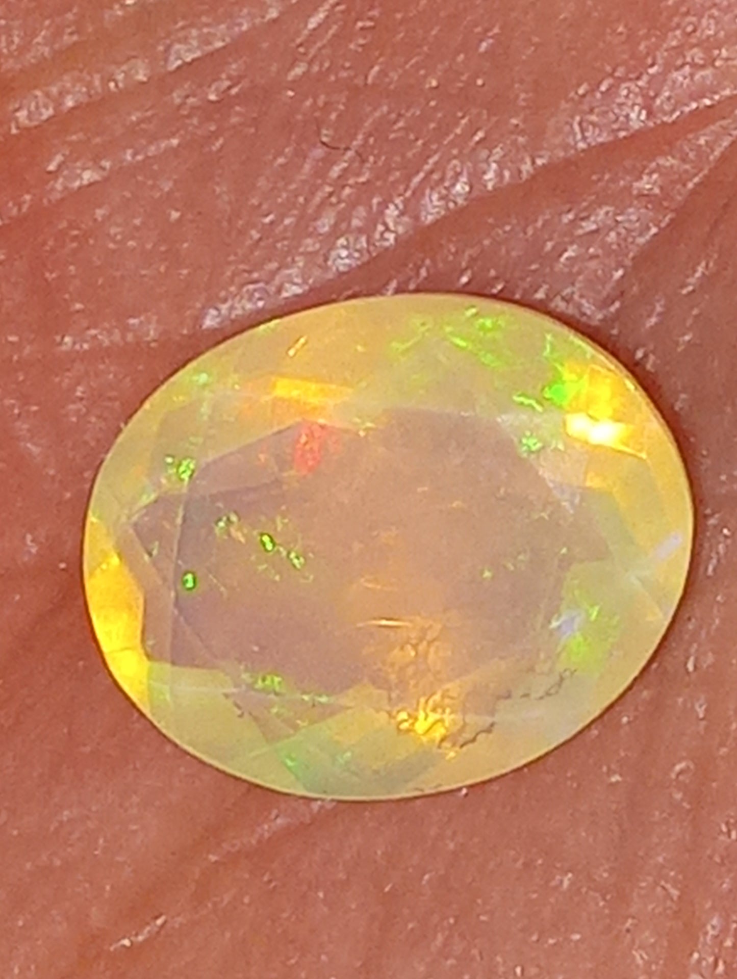 opal gemstone Ethiopian , faceted, 10mmx8mm oval, 1.83ct